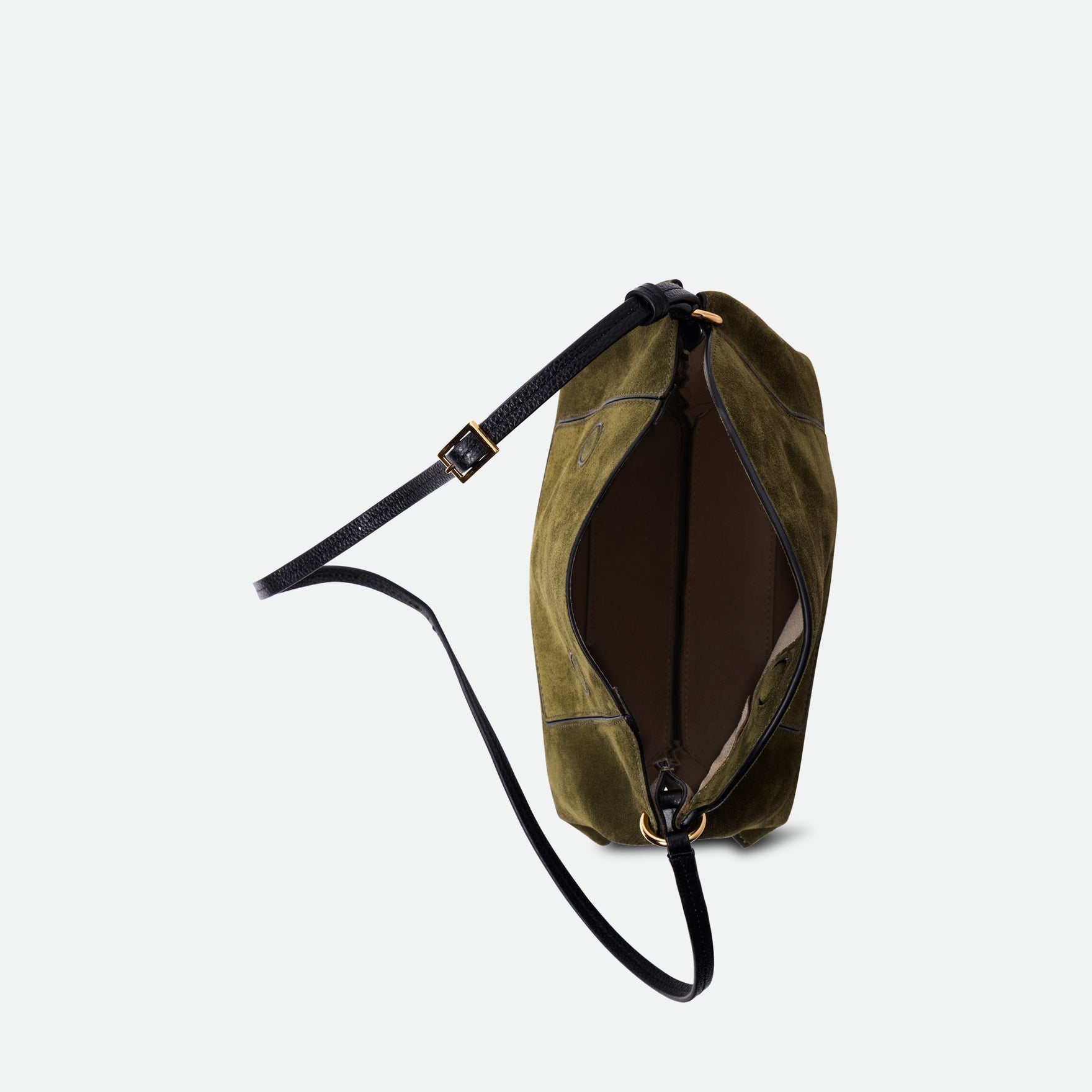 Wandler Penelope Slouch Bag in the color Orion Crust deep dark blue, made from calf leather with golden hardware and adjustable slim strap, pictured from above with the zipper and flap open, giving a glimpse of the inside of the bag. 