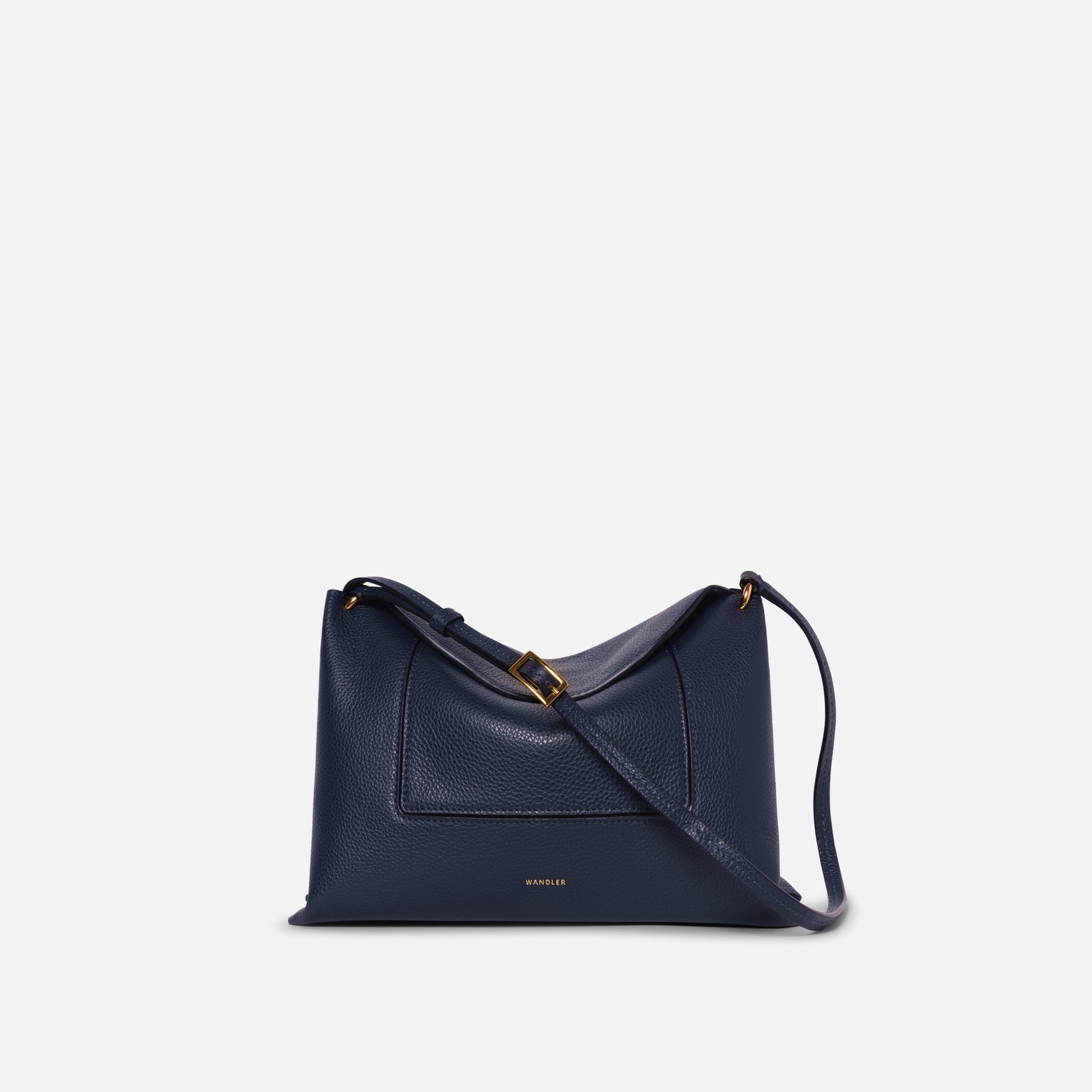Wandler Penelope Slouch Bag in the color Orion Crust deep dark blue, made from calf leather with golden hardware and adjustable slim strap, front view. 