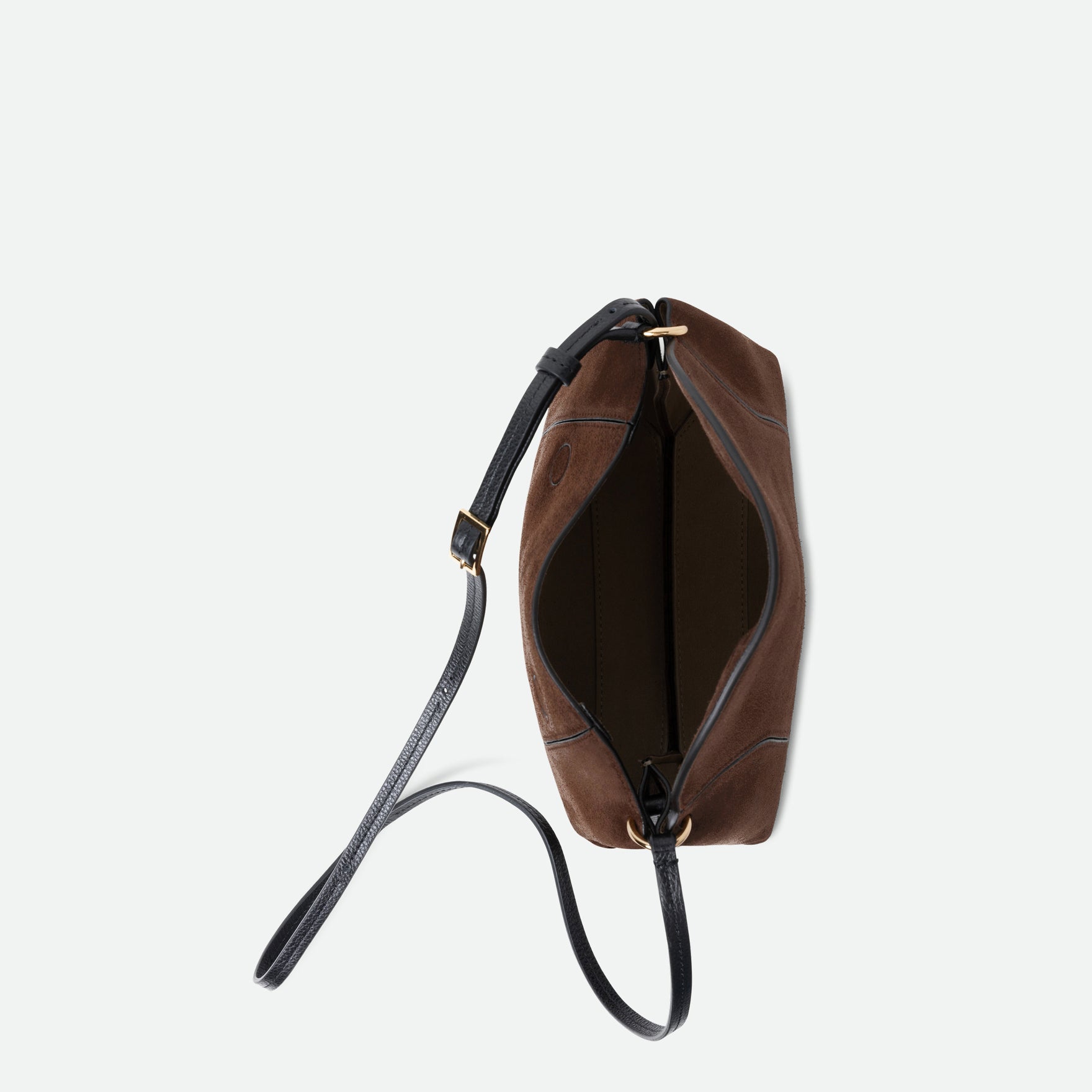 Wandler Penelope Slouch Bag in the color Palissander Suede, made from calf leather with golden hardware and adjustable slim strap, pictured from above with open zipper, allowing for an inside view of the bag.
