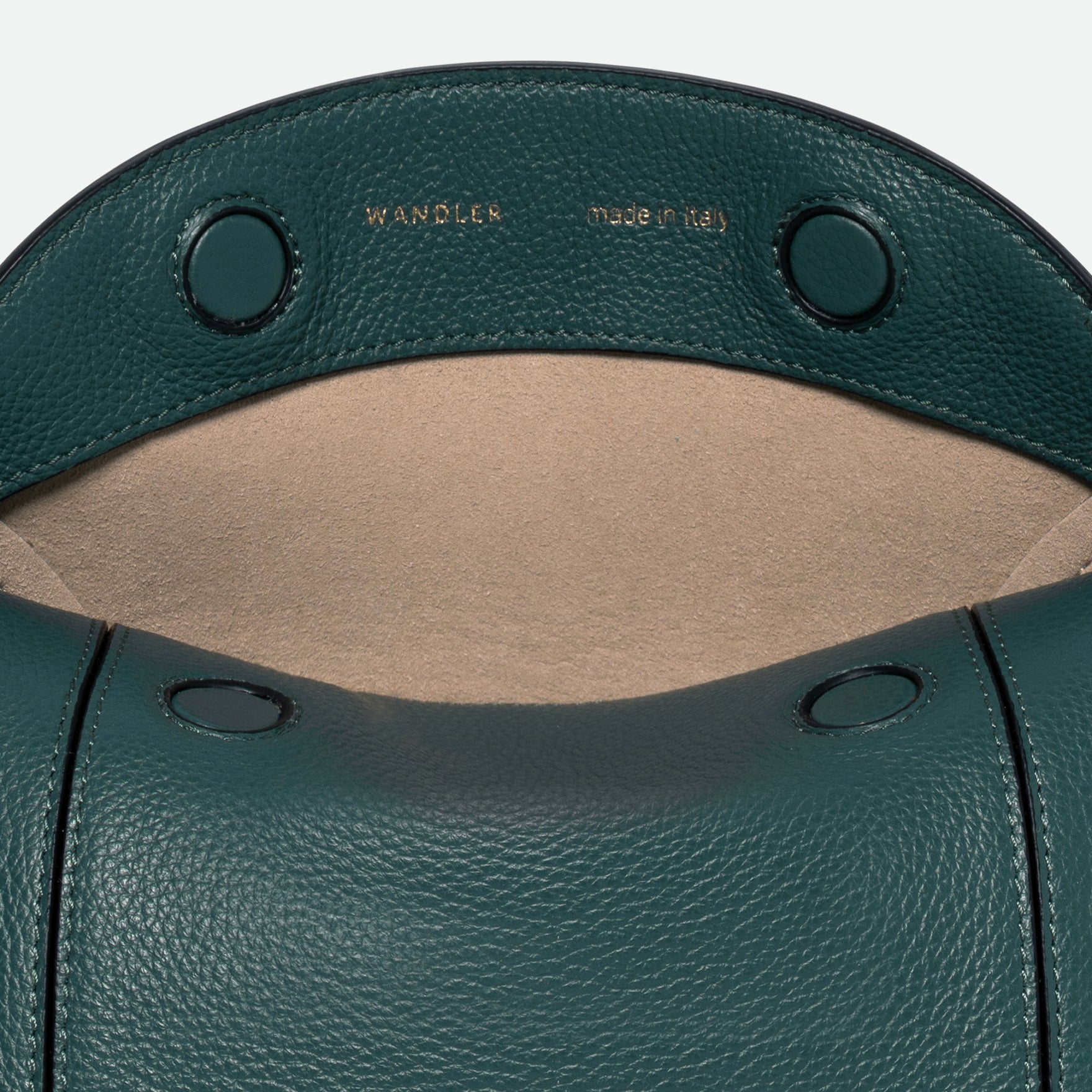 Wandler Penelope Slouch Bag in the color Teal Crust made from calf leather with golden hardware and adjustable slim strap, close up detailing the leather.