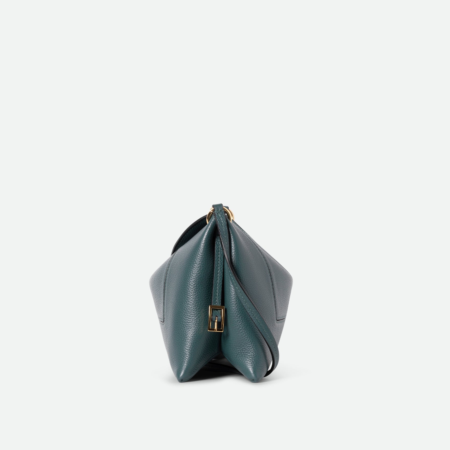 Wandler Penelope Slouch Bag in the color Teal Crust made from calf leather with golden hardware and adjustable slim strap, side view.