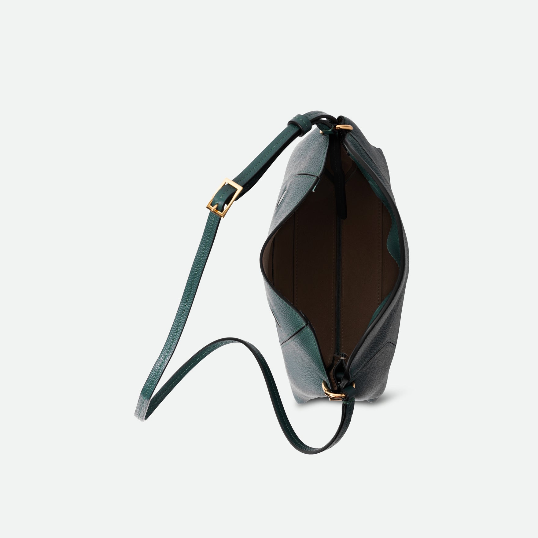 Wandler Penelope Slouch Bag in the color Teal Crust made from calf leather with golden hardware and adjustable slim strap, top side view.