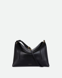 Wandler Penelope Slouch Bag in the color Black Crust, made from smooth calf leather with golden hardware and adjustable slim strap, front view