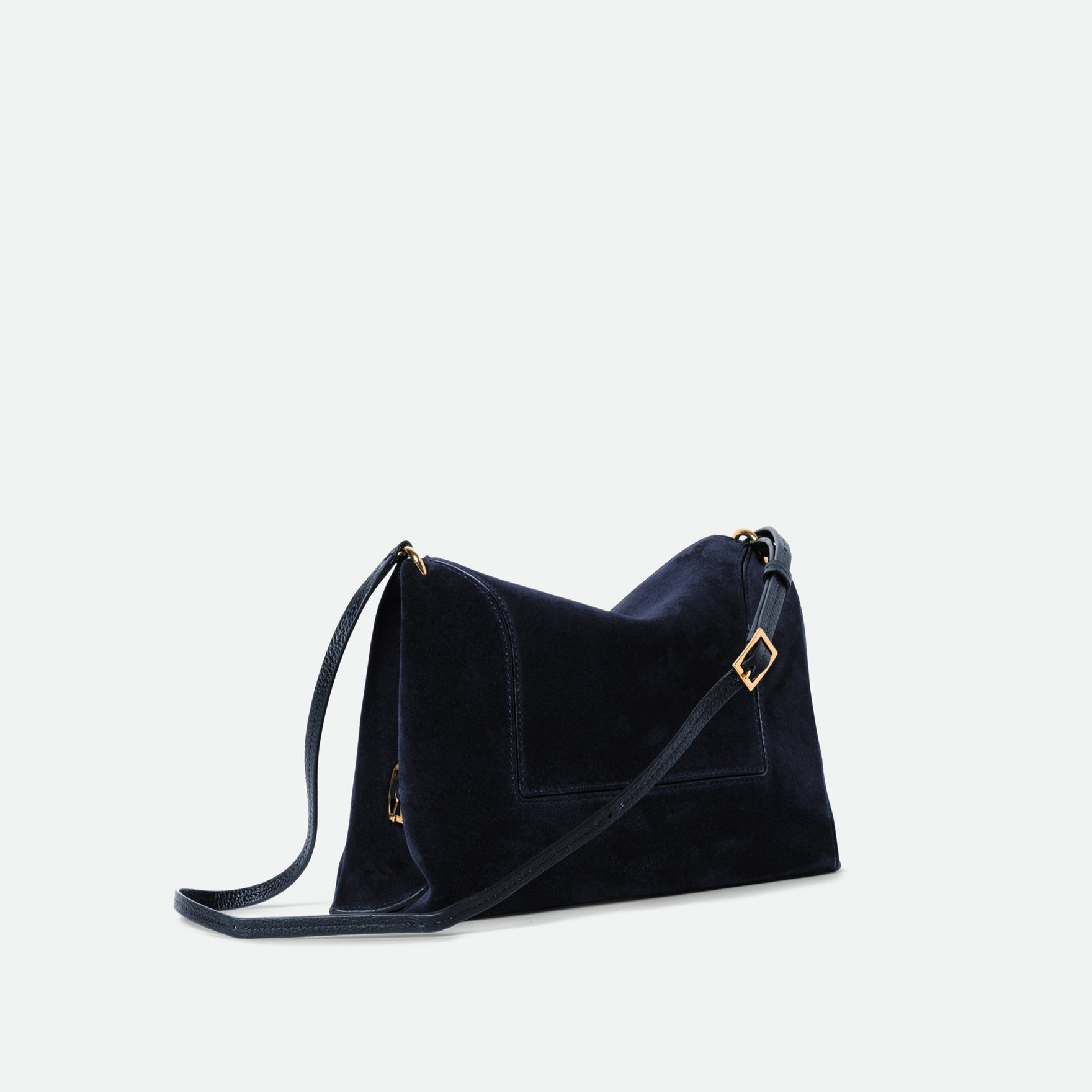 Wandler Penelope Slouch Bag in the color Orion Suede, deep dark blue, made from calf leather with golden hardware and adjustable slim strap, three quarters view.