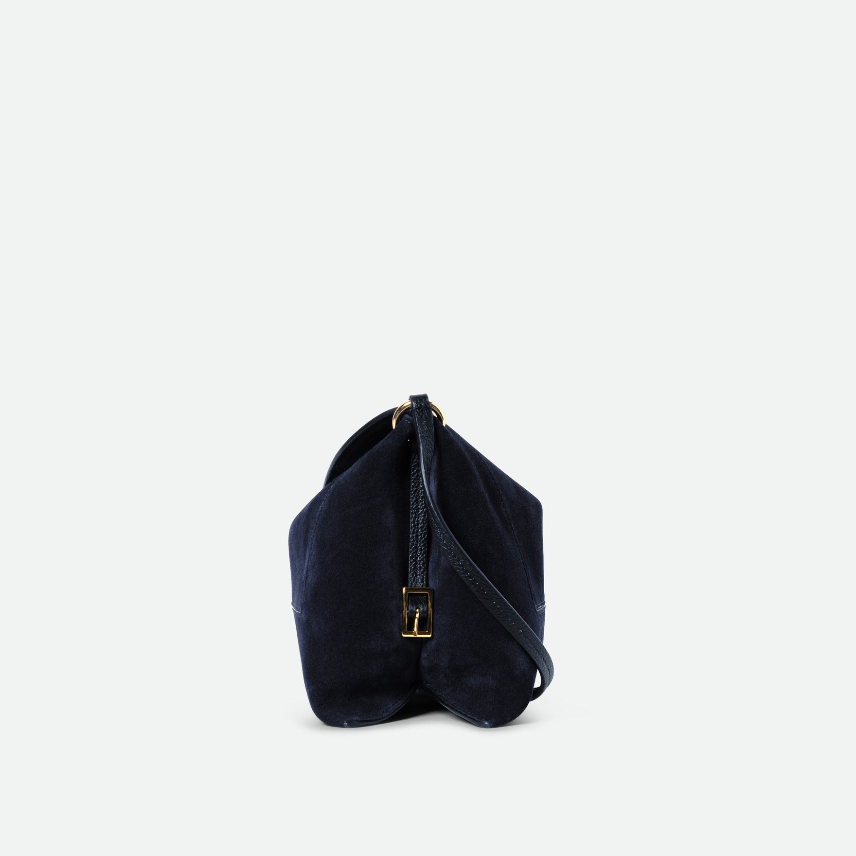 Wandler Penelope Slouch Bag in the color Orion Suede, deep dark blue, made from calf leather with golden hardware and adjustable slim strap, side view. 