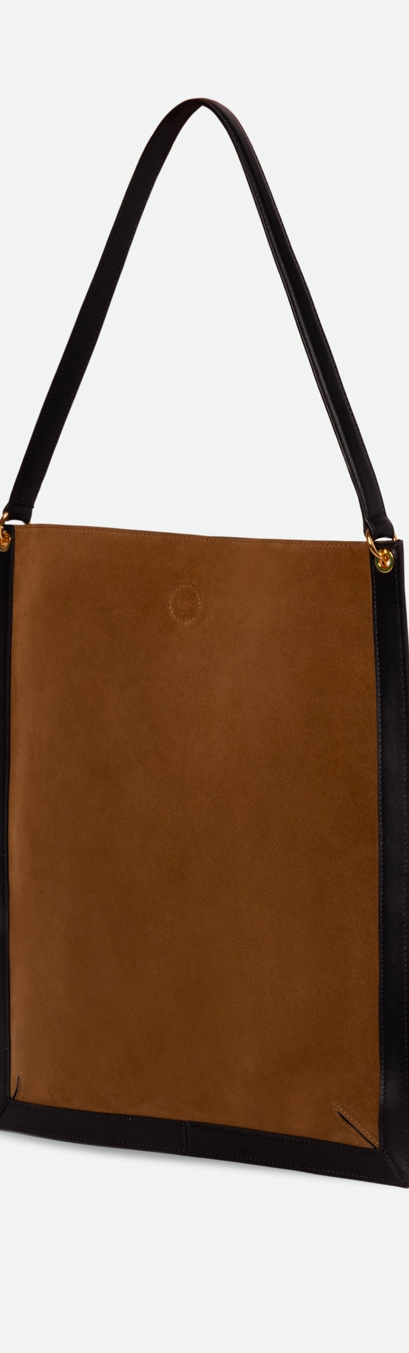 Wandler Penny Tote in the color Tabacco Suede, made from Italian calf leather with hand-painted black edges and golden hardware, three quarters backside view.