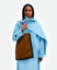 Wandler Penny Tote in the color Tabacco Suede, made from Italian calf leather with hand-painted black edges and golden hardware, pictured being worn on the shoulder by model.