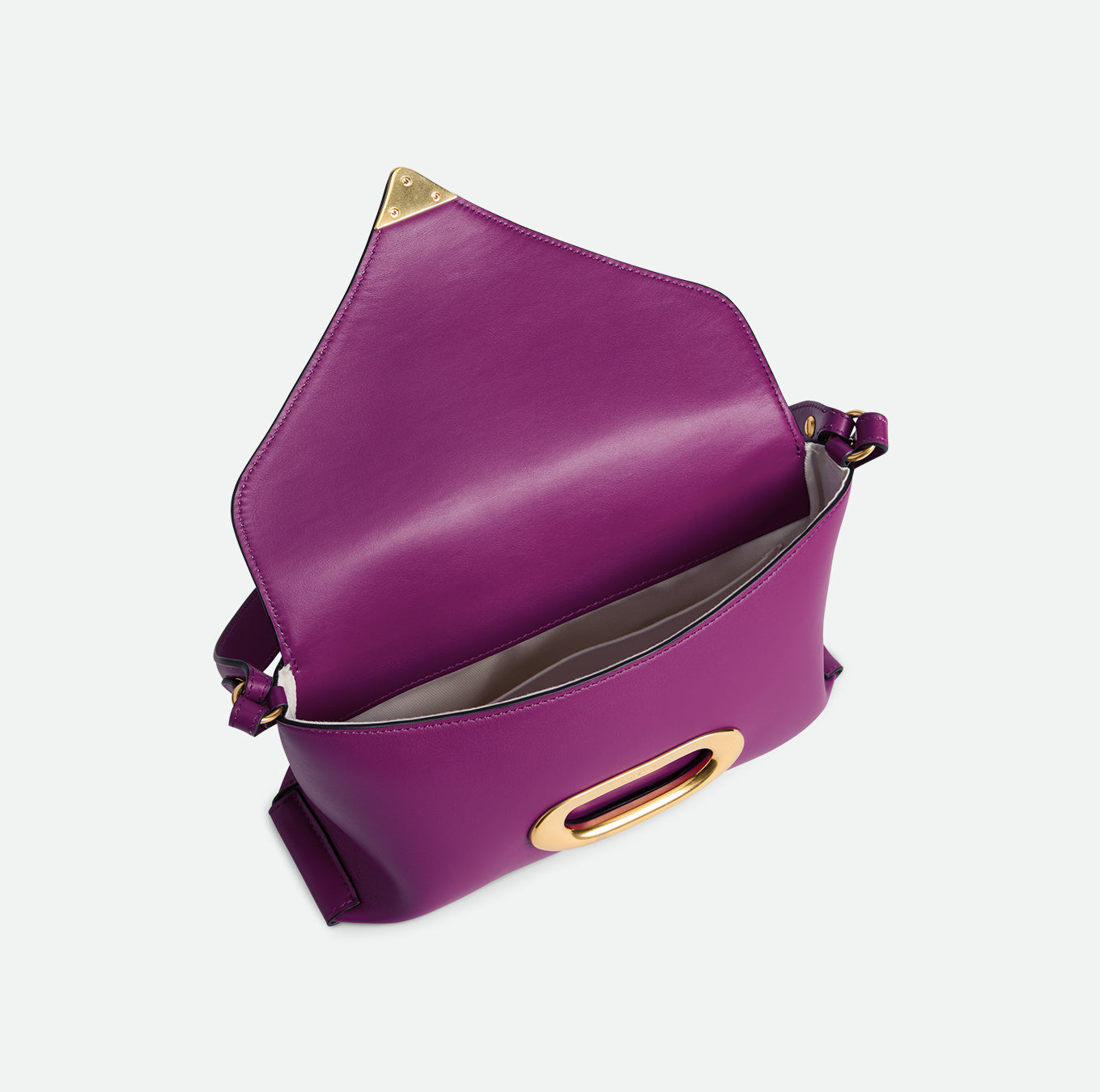 Wandler Veneto Shoulder Bag Small in the color Cobra, made from Italian calf leather with oversized golden clasp hardware, structured silhouette, pictured from above with the flap open, giving a glimpse into the inside of the bag. 