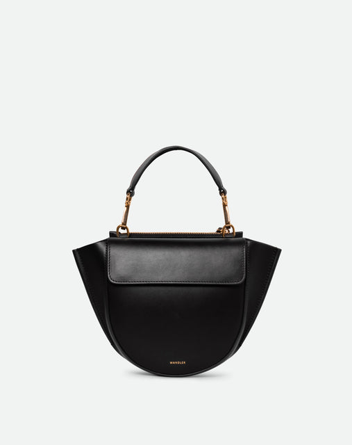 Wandler Hortensia Bag Mini in the color black, Italian calf leather with golden hardware, rounded silhouette and top handle, front view.