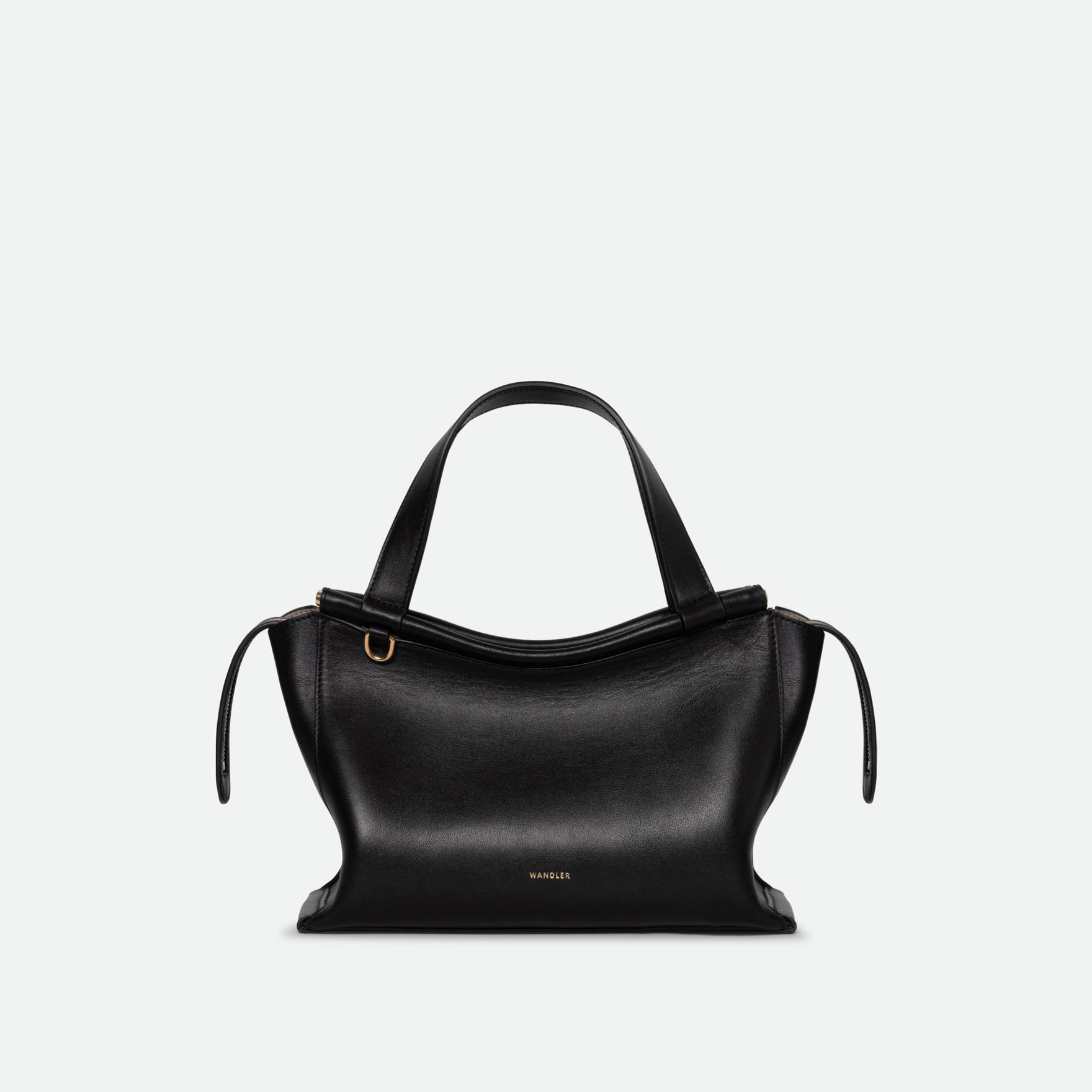 Wandler Ida Bag in the color Black, made from Italian calf leather with golden hardware and sculptural top handle, front view.