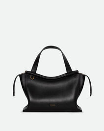 Wandler Ida Bag in the color Black, made from Italian calf leather with golden hardware and sculptural top handle, front view.