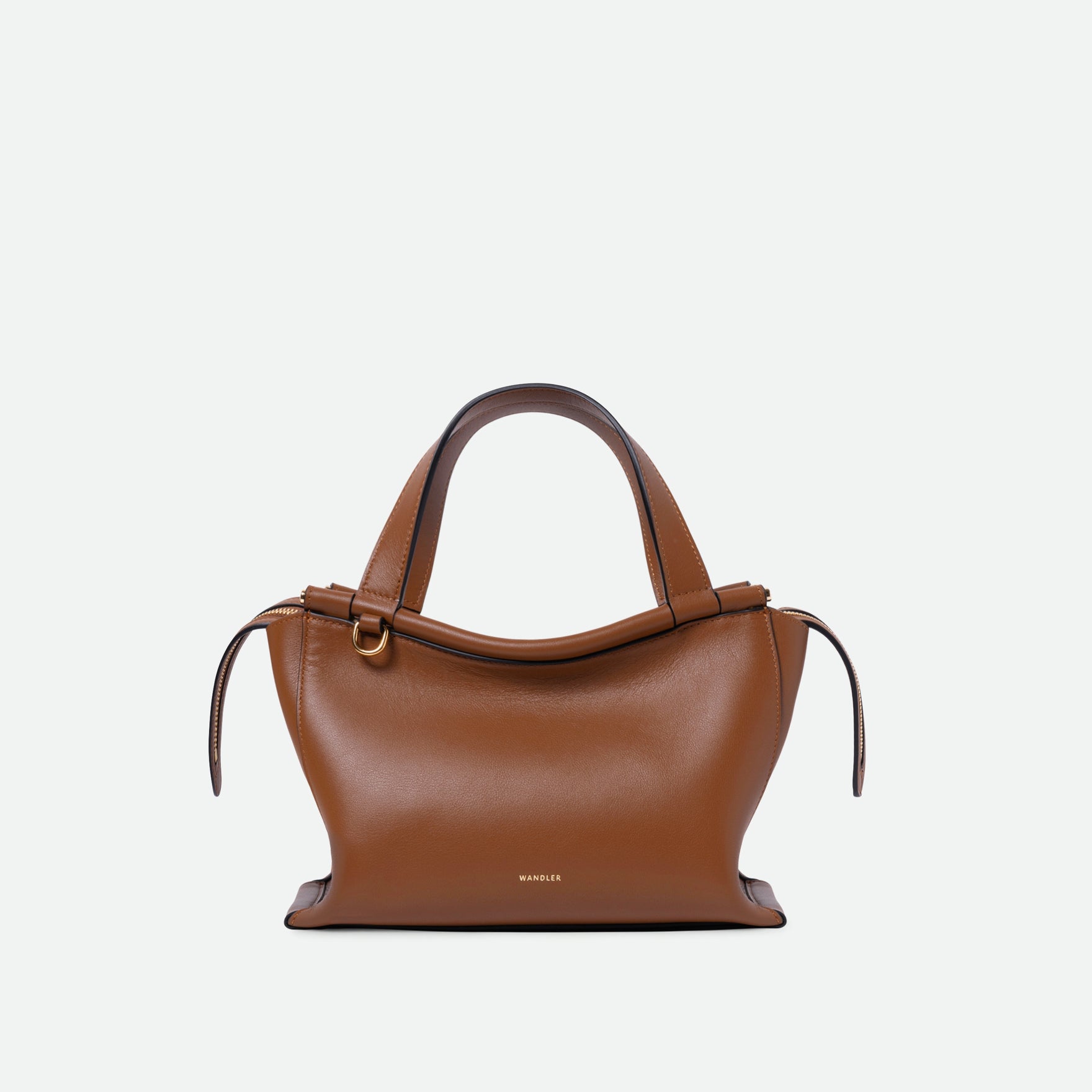 Wandler Ida Bag in the color Saddle, warm brown, made from Italian calf leather with golden hardware and sculptural top handle, front view.