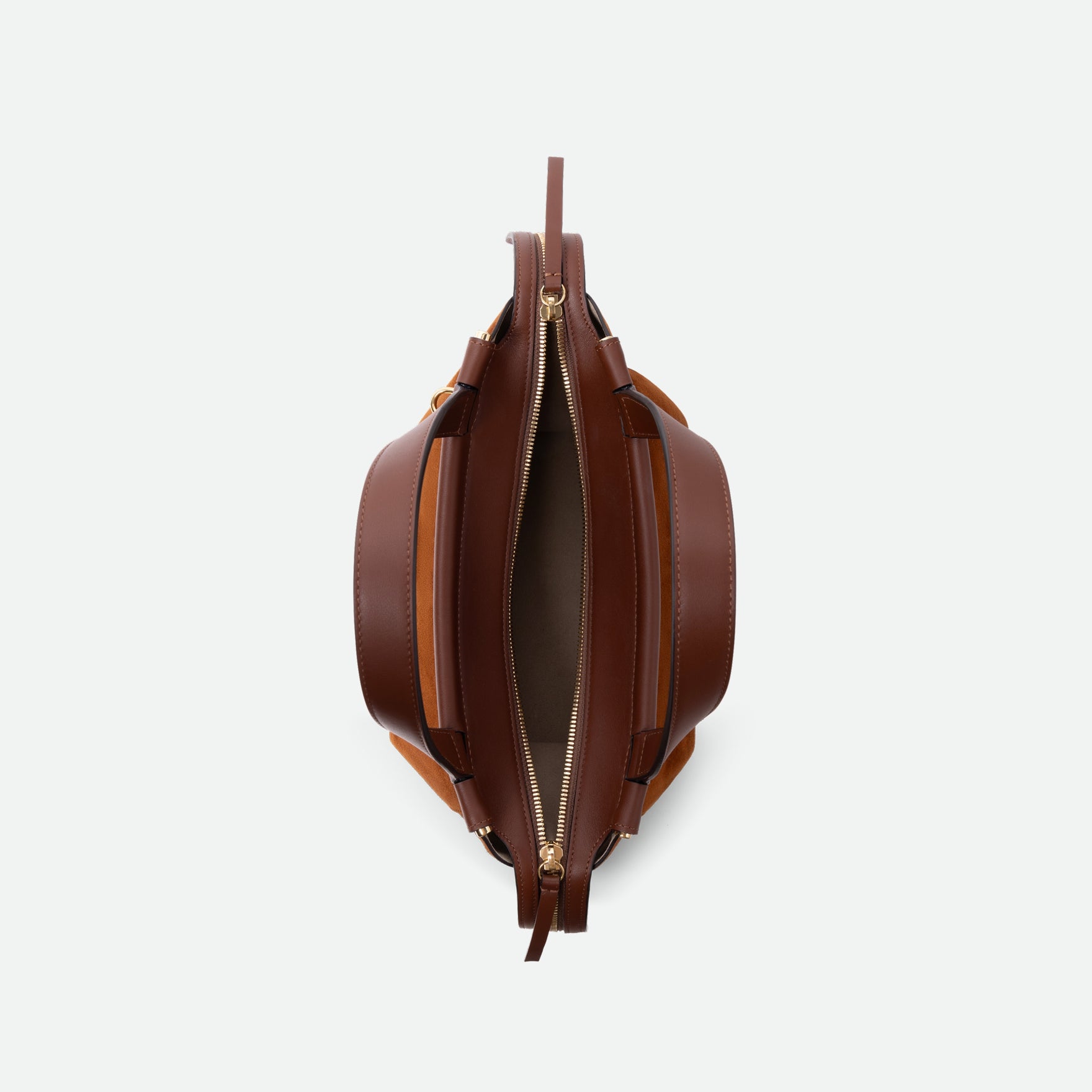 Wandler Ida Bag in the color Tan Suede, made from Italian calf leather with golden hardware and sculptural top handle, pictured from above with the bag open.