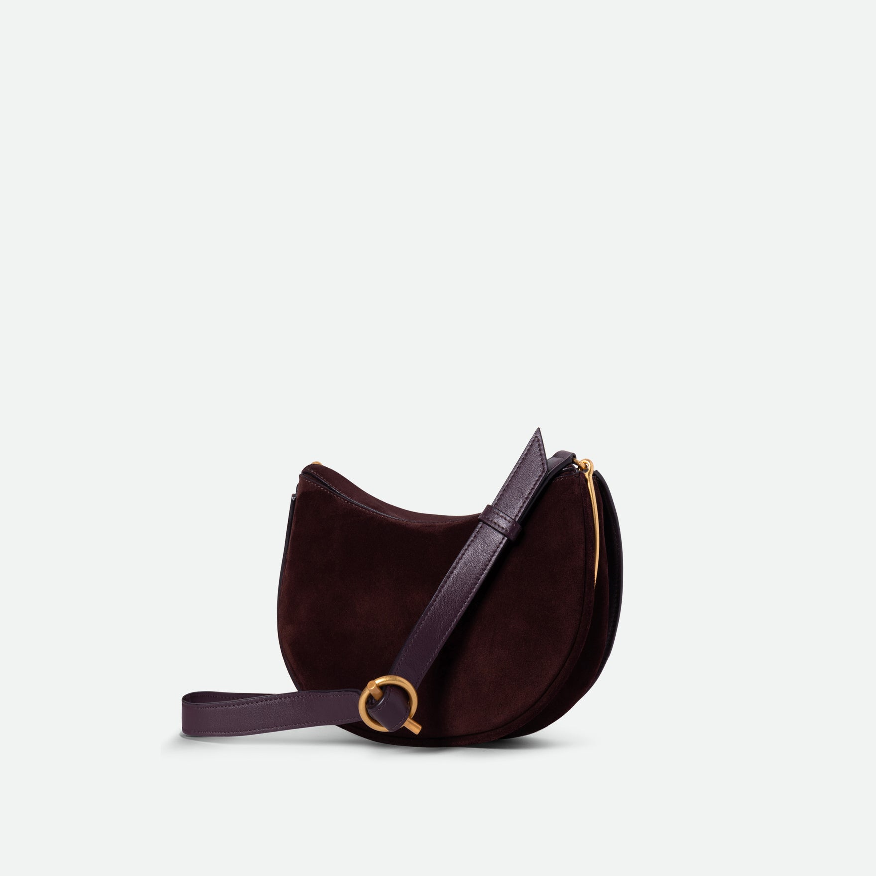 Wandler Kate Bag in the color Acai Suede, made from calf leather with golden hardware and adjustable shoulder strap, backside view, three quarters angle.