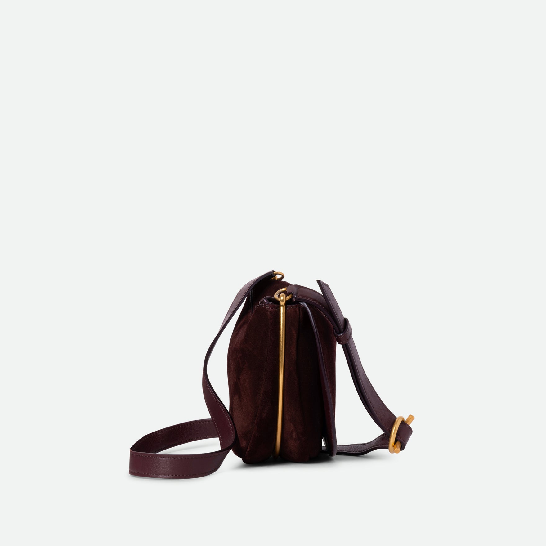 Wandler Kate Bag in the color Acai Suede, made from calf leather with golden hardware and adjustable shoulder strap, side view.
