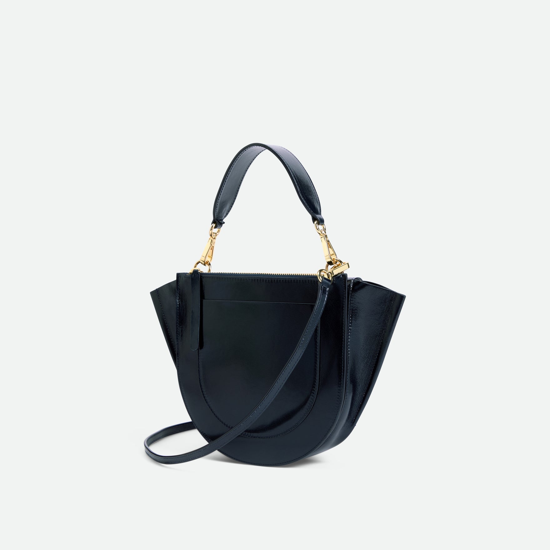 Wandler Hortensia Bag Small in the color Orion Glaze, deep dark blue, Italian calf leather with golden hardware and rounded silhouette, backside view.