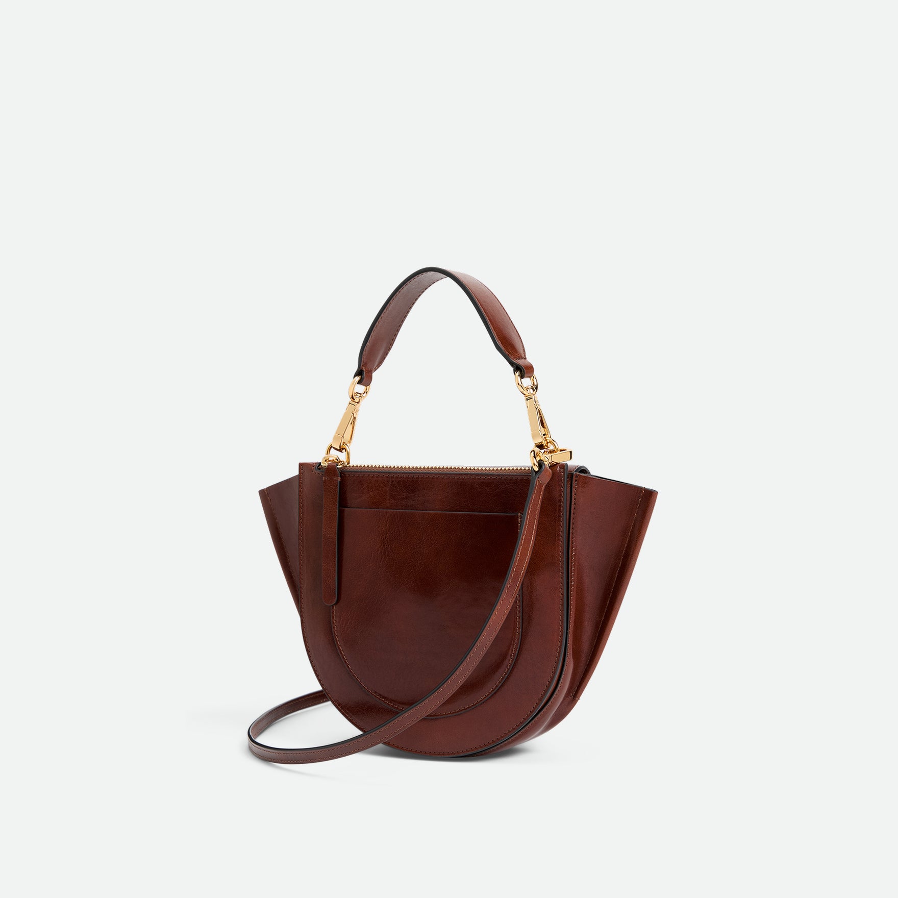 Wandler Hortensia Bag Mini in the color Palissander Glaze, deep dark brown with red undertones, made from Italian calf leather with golden hardware, rounded silhouette and top handle, backside view, three quarters angle