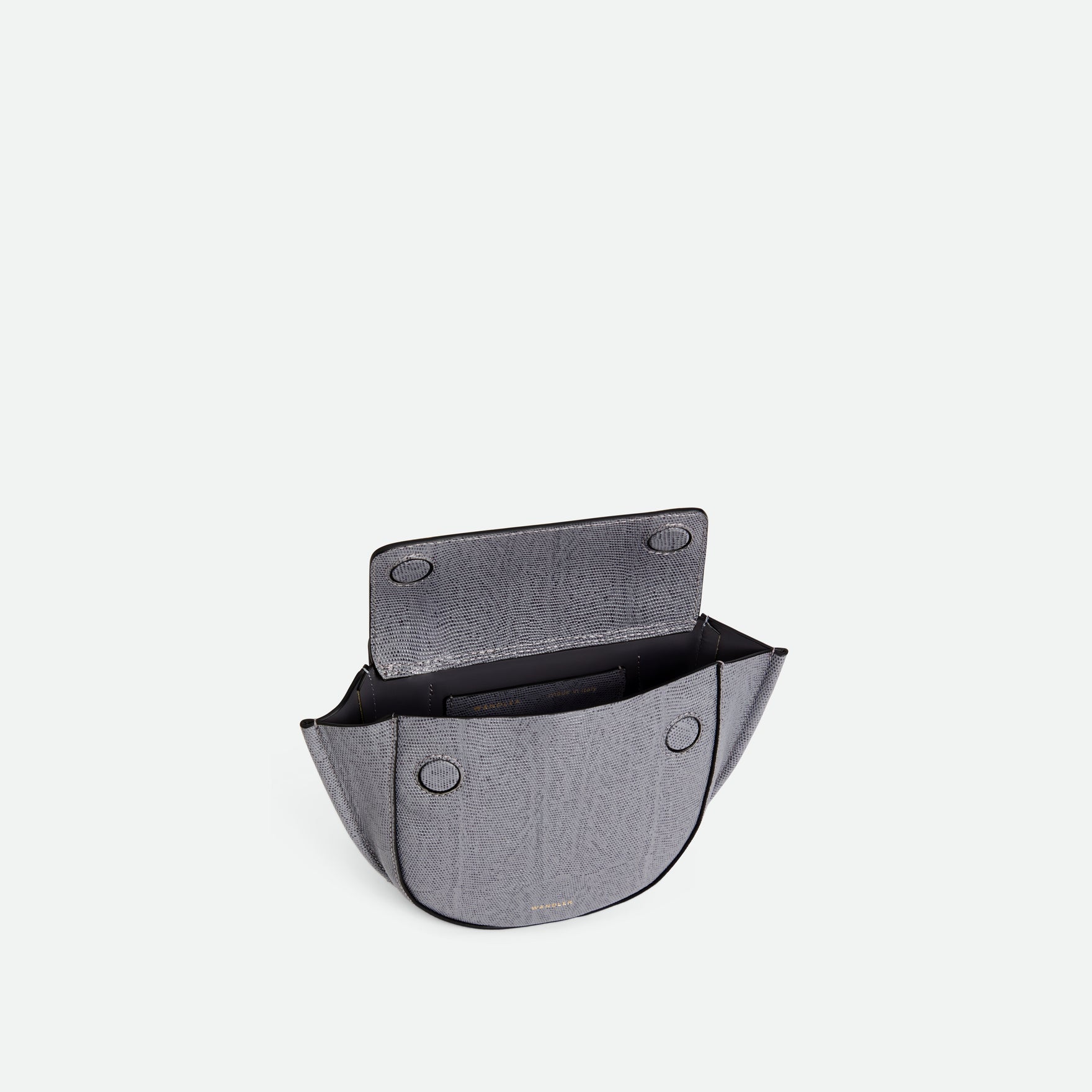 Wandler Hortensia Bag Piccola in the color  Grey Lizzard, grey with lizard motive, made from Italian calf leather with golden hardware and rounded silhouette. The bag is pictured from the front with the flap open, giving a slight view of the inside of the bag.
