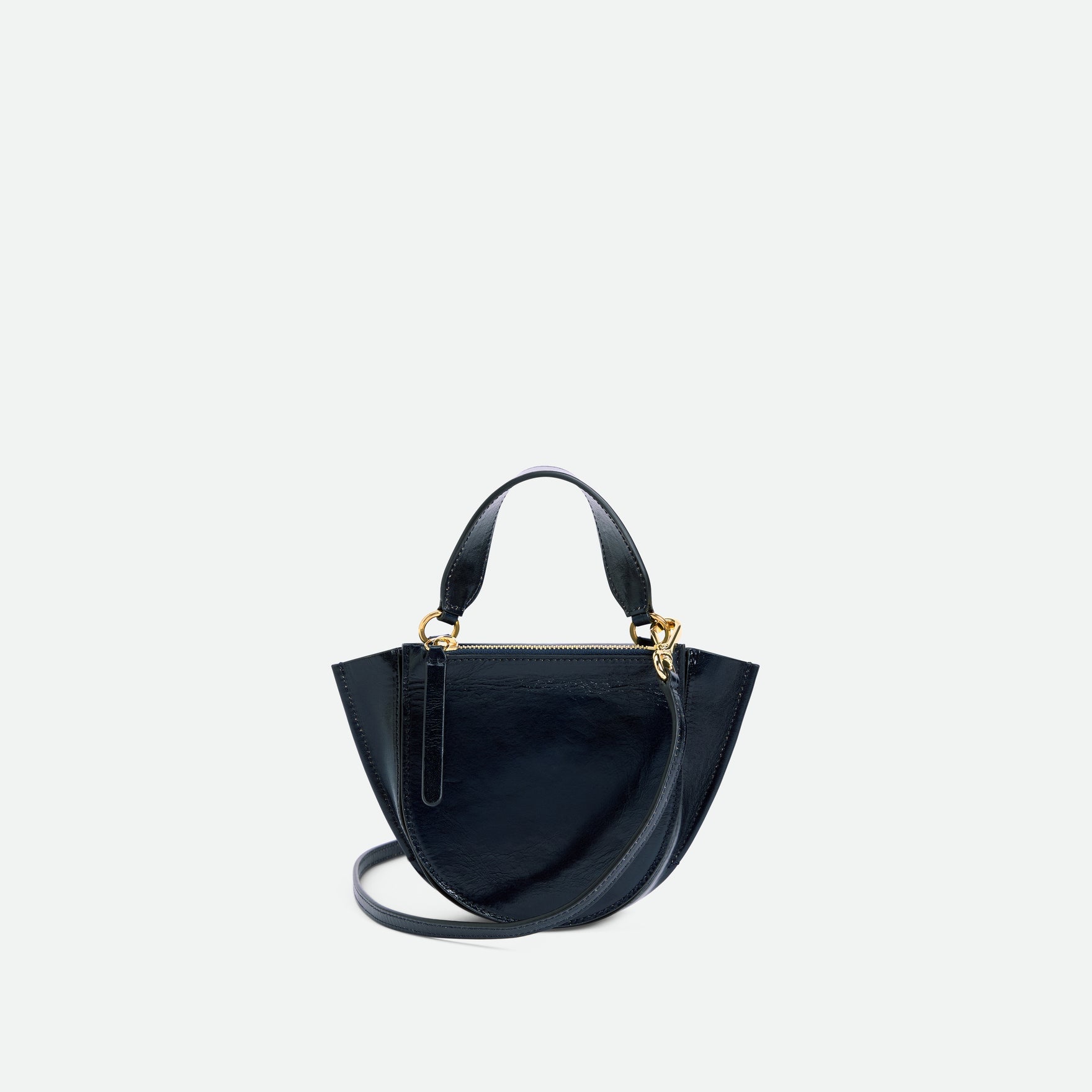 Wandler Hortensia Bag Piccola in the color Orion Glaze, shiny dark blue, made from Italian calf leather with golden hardware and rounded silhouette, backside view.