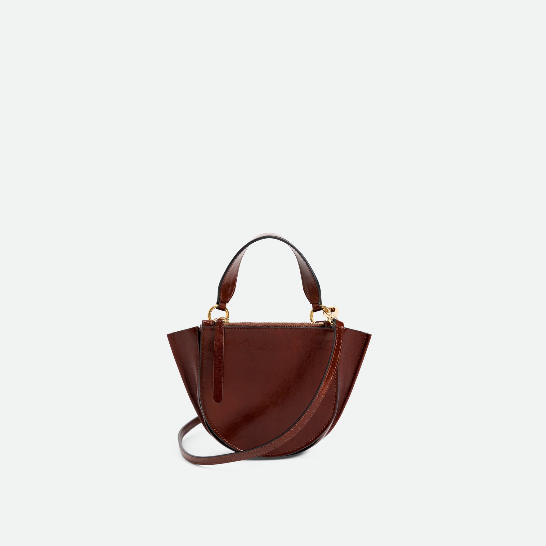 Wandler Hortensia Bag Piccola in the color Palissander Glaze, shiny dark red, made from Italian calf leather with golden hardware and rounded silhouette, backside view.