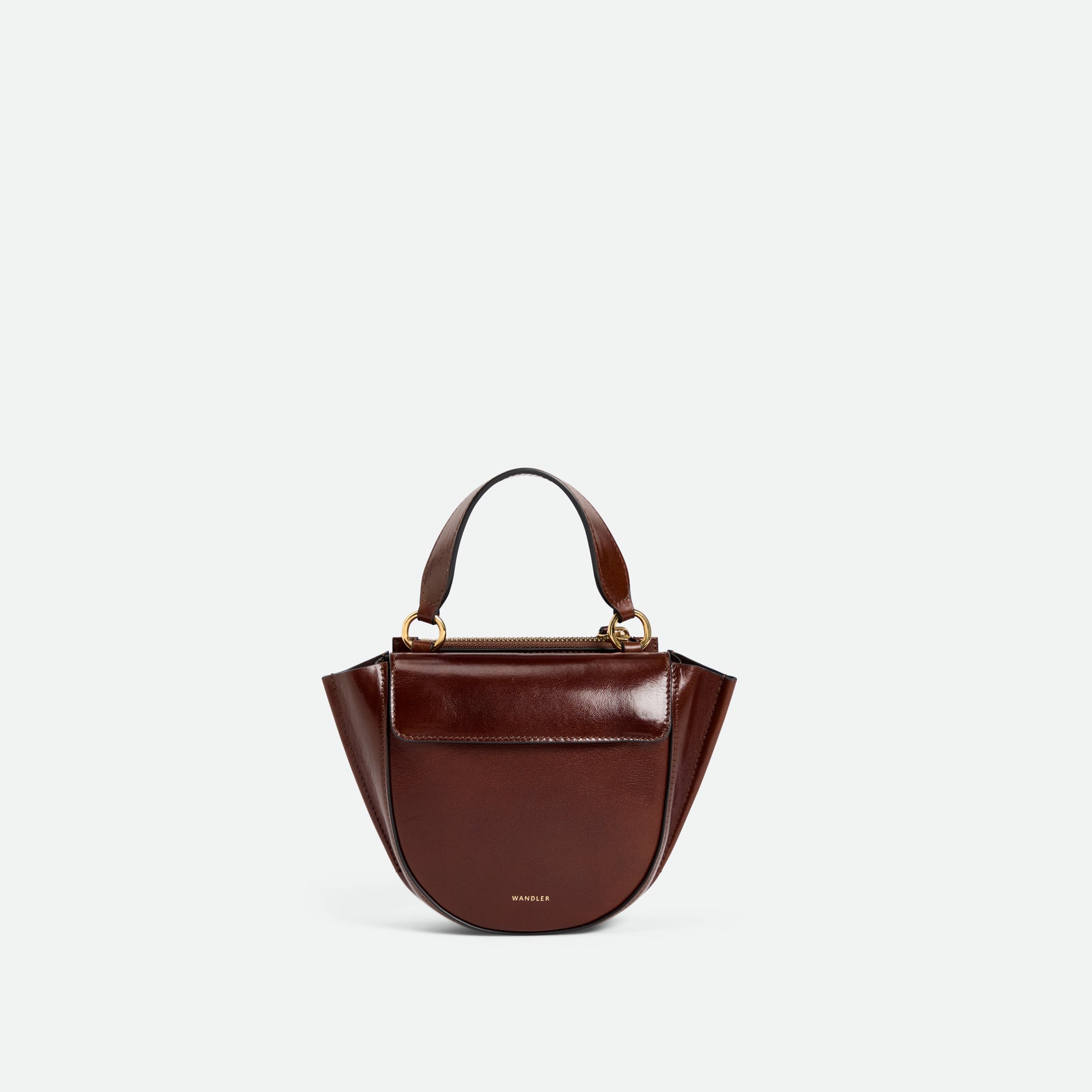 Wandler Hortensia Bag Piccola in the color Palissander Glaze, shiny dark red, made from Italian calf leather with golden hardware and rounded silhouette, front view.
