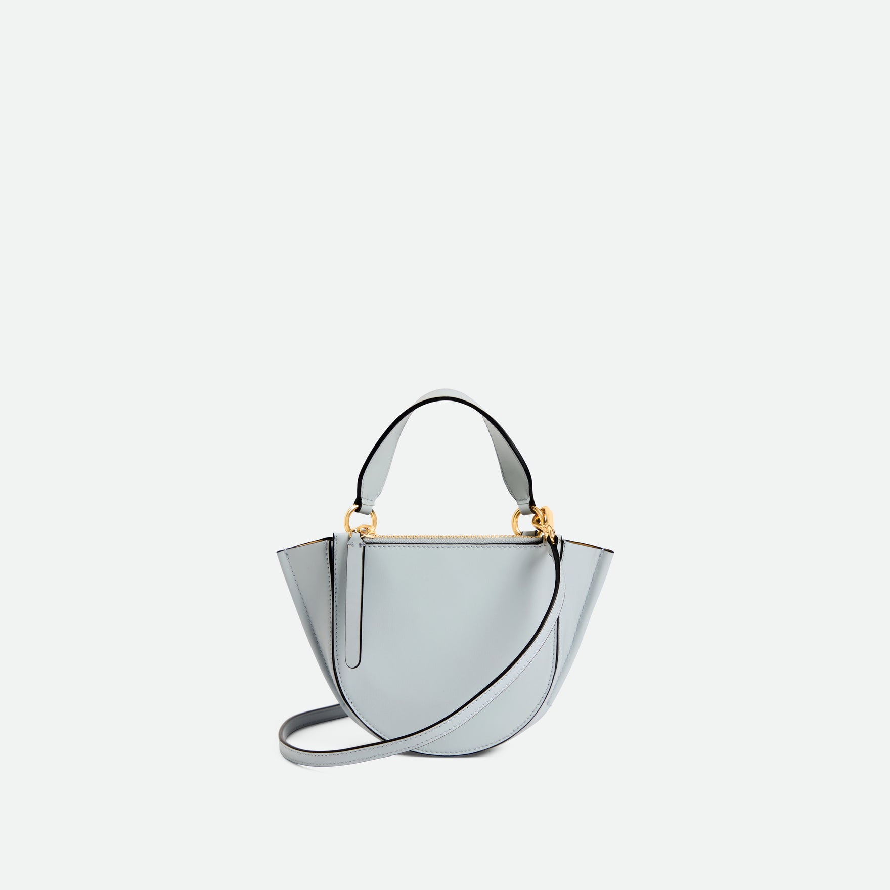 Wandler Hortensia Bag Piccola in the color  Steel, cold grey, made from Italian calf leather with golden hardware and rounded silhouette, backside view.