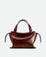 Wandler Ida Bag in the color Palissander Glaze, deep dark brown with red undertones, made from Italian calf leather with golden hardware and sculptural top handle, front view. 