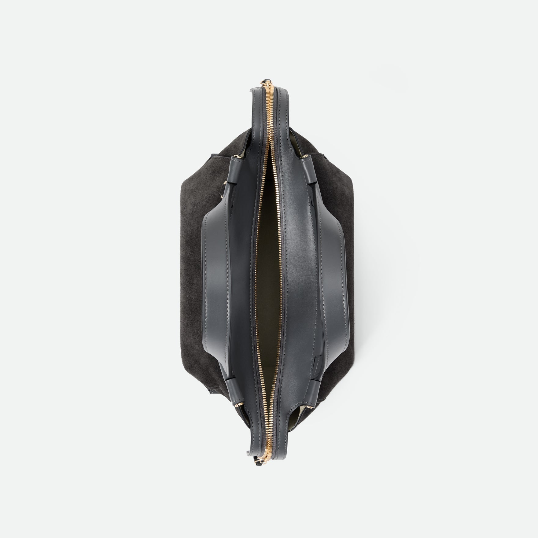 Wandler Ida Bag in the color Space Suede, made from Italian calf leather with golden hardware and sculptural top handle, topside view with the zipper open, giving a glimpse of the inside of the bag. 
