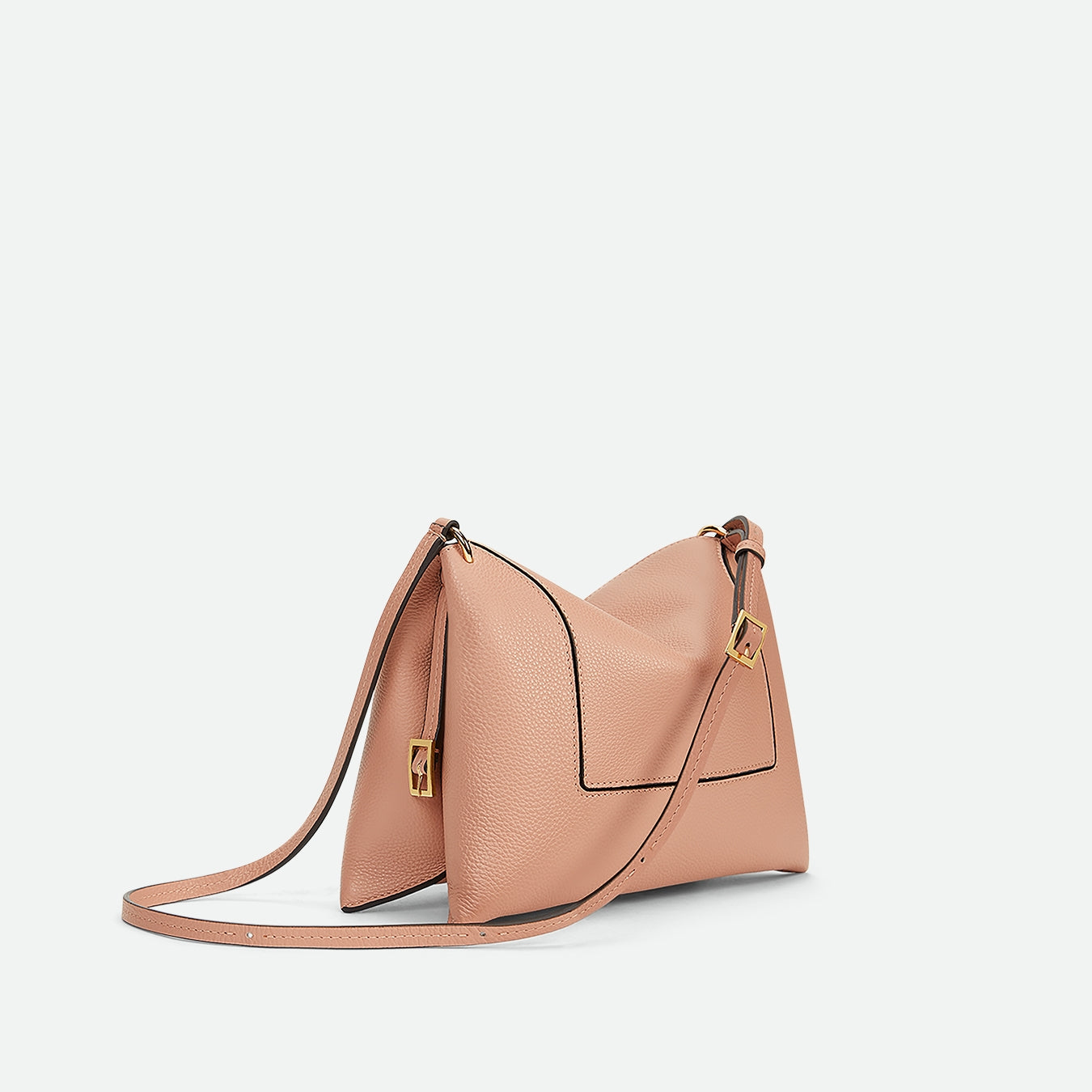 Wandler Penelope Slouch Bag in the color Apricot Crust, made from calf leather with golden hardware and adjustable slim strap, backside view three quarters.