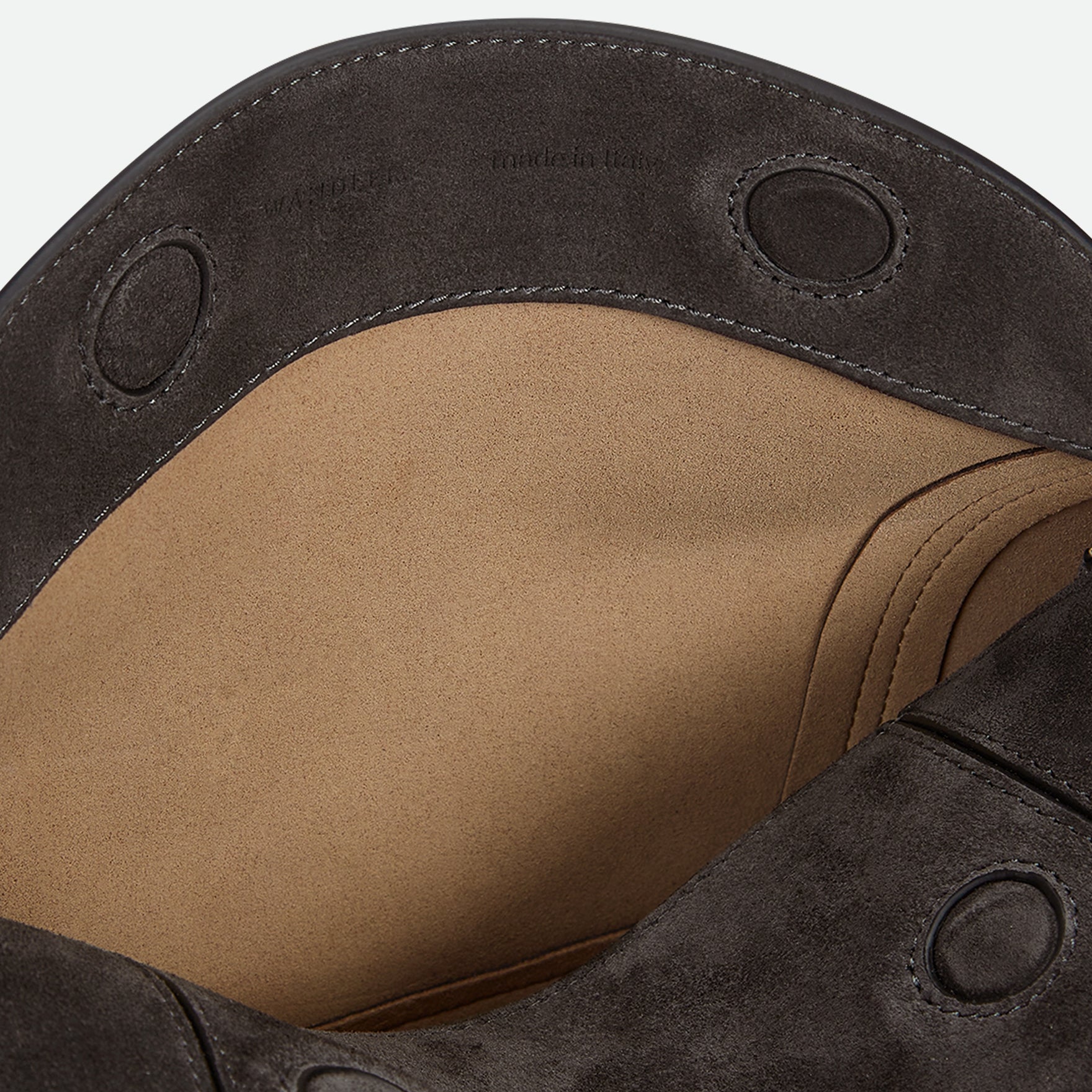 Wandler Penelope Slouch Bag in the colour Space Suede, grey, made from smooth calf leather with golden hardware and adjustable slim strap, close up detailing the logo and the inside of the bag. 
