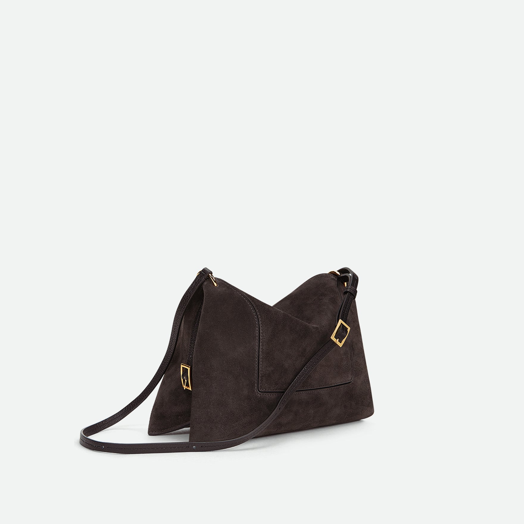 Wandler Penelope Slouch Bag in the colour Space Suede, grey, made from smooth calf leather with golden hardware and adjustable slim strap, three quarters angle.