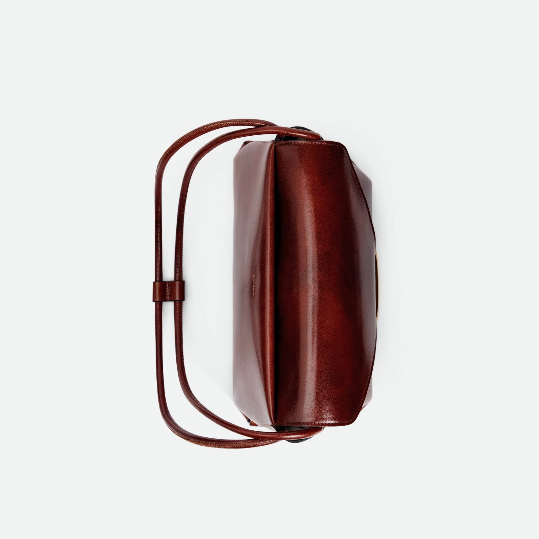 Wandler Veneto Shoulder Bag in the color in Palissander Glaze, deep dark red, Italian calf leather with oversized golden clasp hardware and structured silhouette, topside view.
