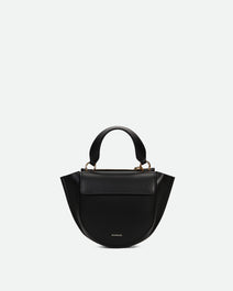 Wandler Hortensia Bag Piccola in the color Black made from Italian calf leather with golden hardware and rounded silhouette, front view.