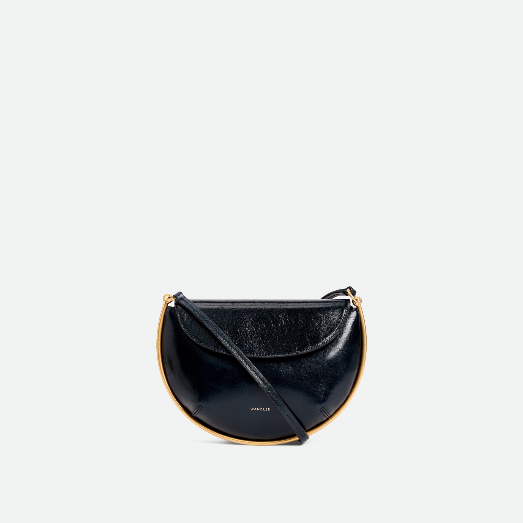 Wandler Kate Mini Crossbody in the color Orion Glaze, deep dark blue, made from Italian calf leather with golden hardware and adjustable strap, front view.
