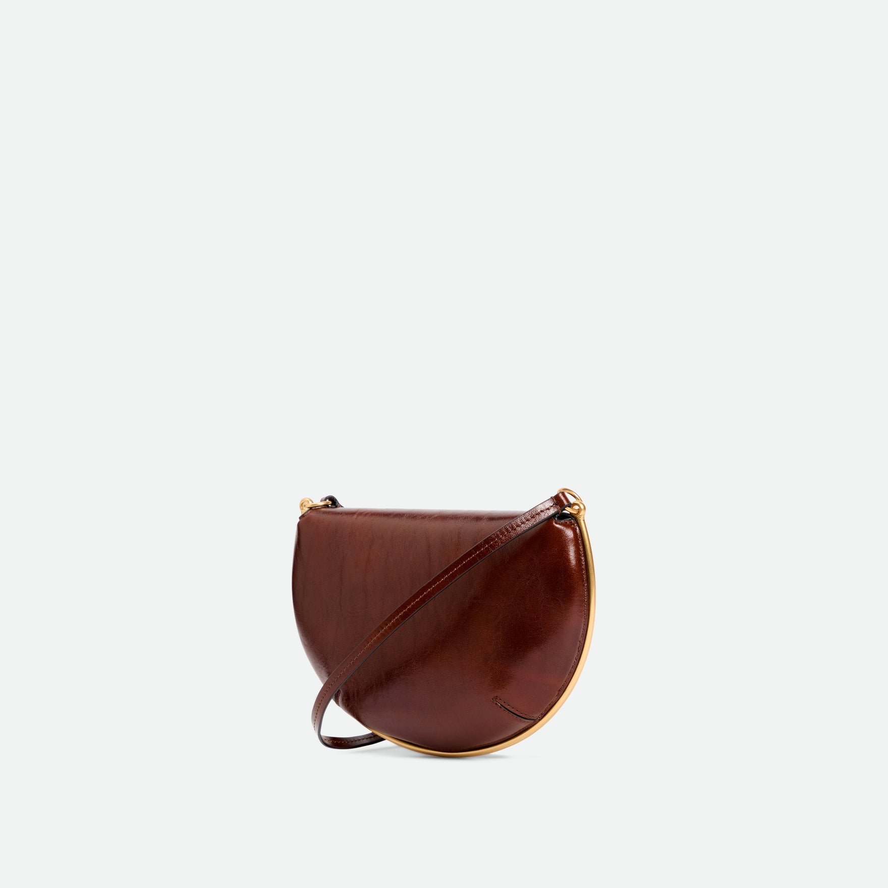 Wandler Kate Mini Crossbody in the color Palissander Glaze, Deep dark brown with red undertones, made from Italian calf leather with golden hardware and adjustable strap, backside view, three quarters angle. 