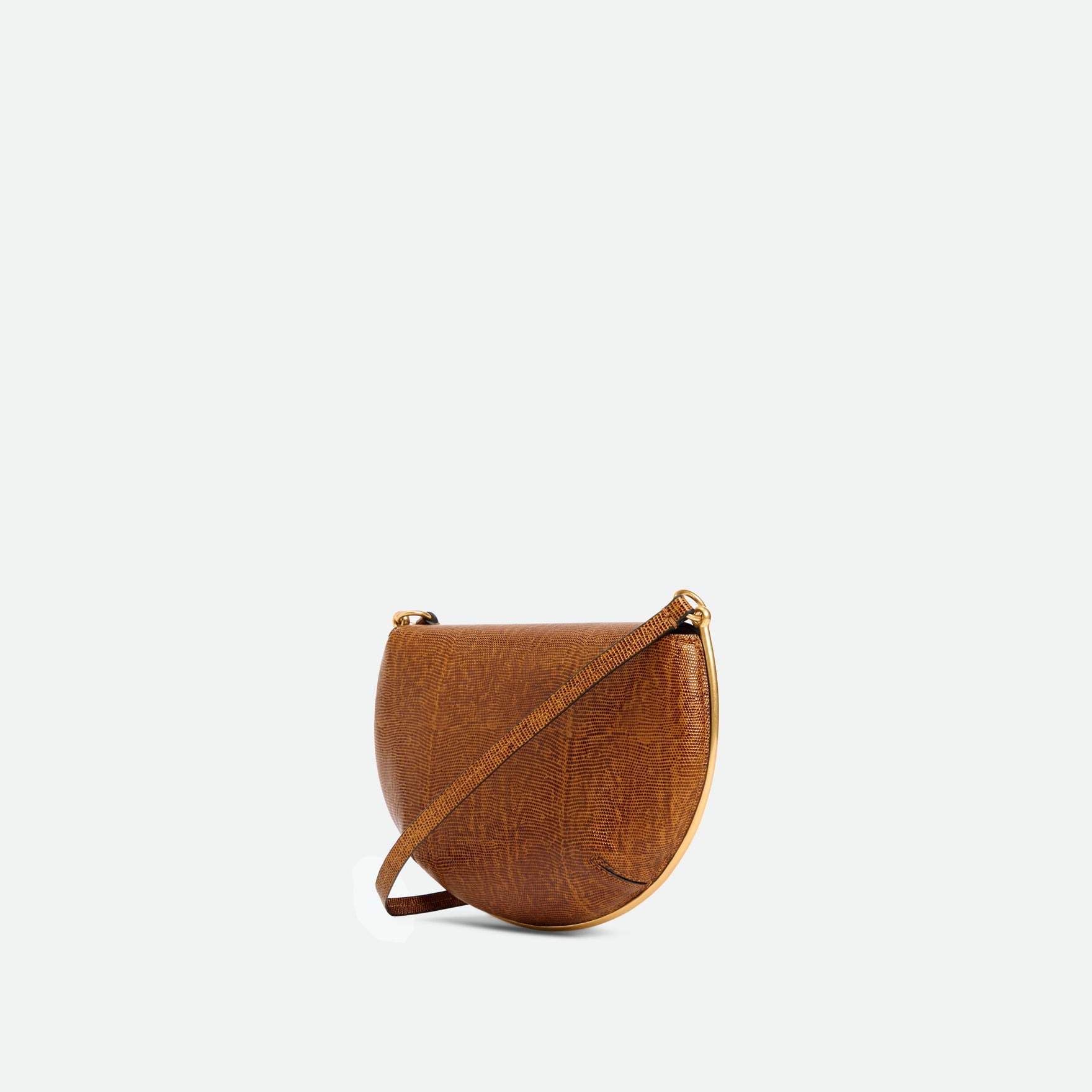 Wandler Kate Mini Crossbody in the color Tabacco Lizzard, Warm brown with lizzard motive, made from Italian calf leather with golden hardware and adjustable strap, backside view, three quarters angle.