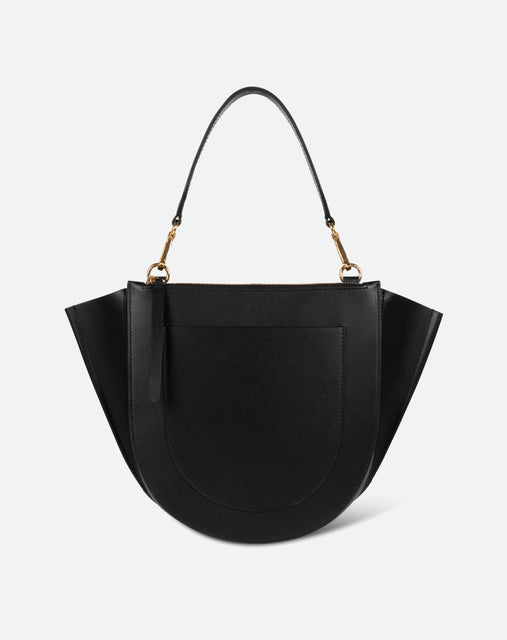 Wandler Hortensia Bag Medium in the color Black, made from Italian calf leather with golden hardware, rounded silhouette and top handle, backside view. 