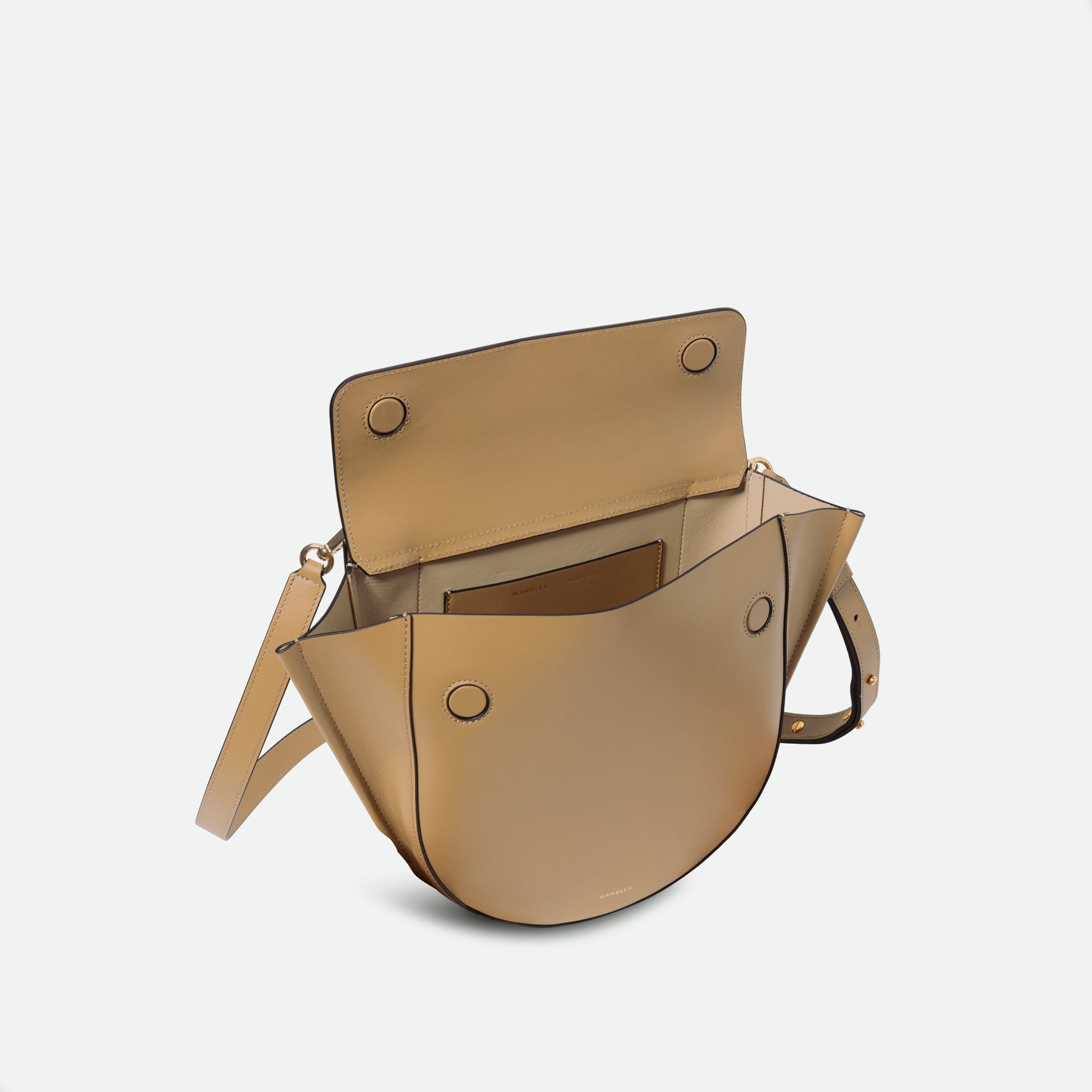 Wandler Hortensia Bag Medium in the color Gingerbread, dark beige, made from Italian calf leather with golden hardware, rounded silhouette and top handle, front view, pictured from above with the flap open, giving a glimpse of the inside of the bag.
