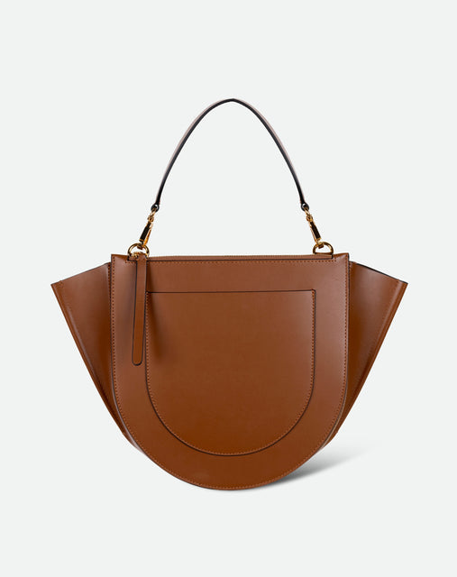 Wandler Hortensia Bag Medium in the color Saddle, warm brown, made from Italian calf leather with golden hardware, rounded silhouette and top handle, backside view.