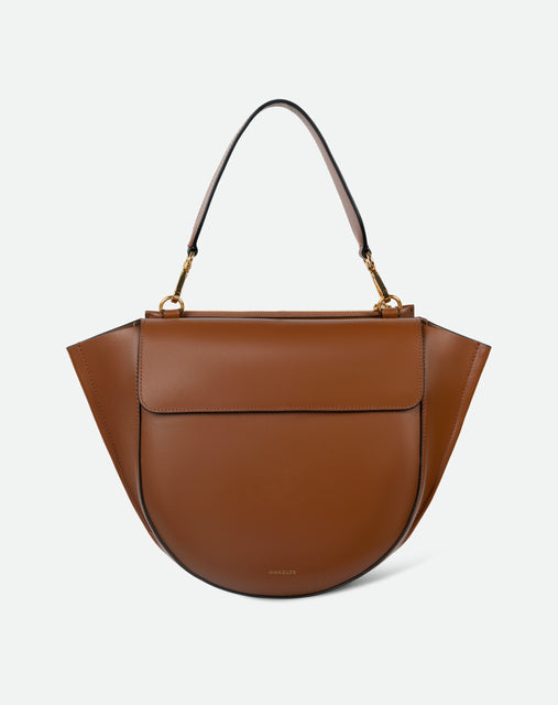 Wandler Hortensia Bag Medium in the color Saddle, warm brown, made from Italian calf leather with golden hardware, rounded silhouette and top handle, front view. 
