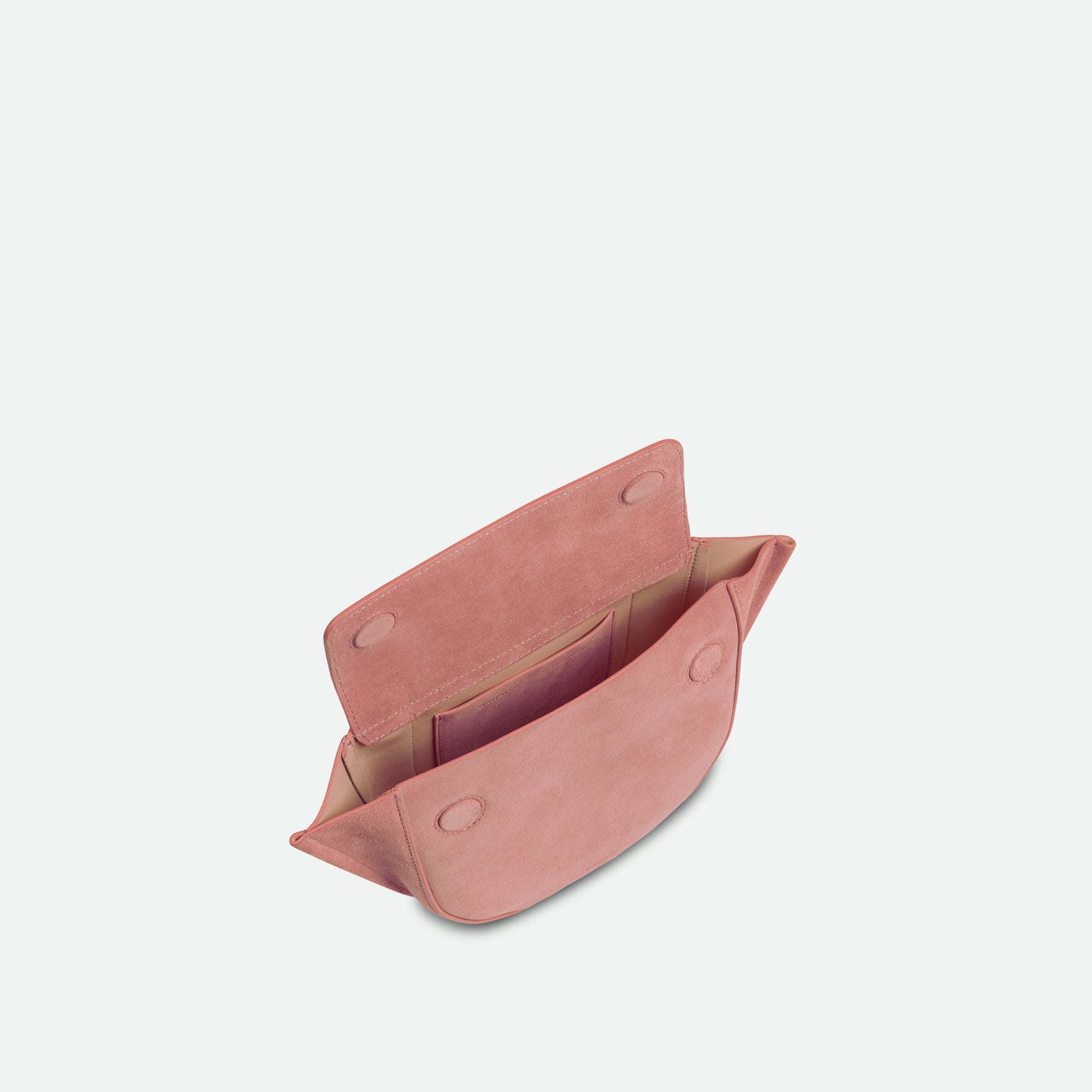 Wandler Hortensia Bag Mini in the color Apricot Suede, light pink suede, Italian calf leather with golden hardware, rounded silhouette and top handle. The bag is pictured from the front with the flap open, giving a slight view of the inside of the bag.