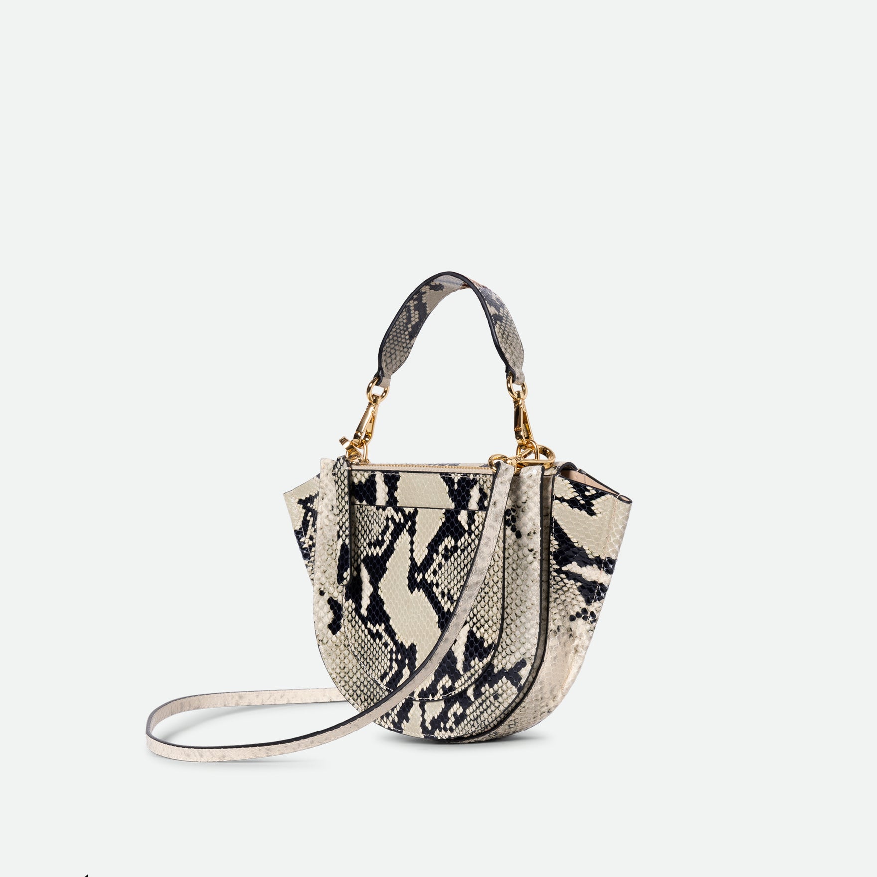 Wandler Hortensia Bag Mini in the color Black / White Python, Italian calf leather with golden hardware, rounded silhouette and top handle, three quarters angle, backside view. 
