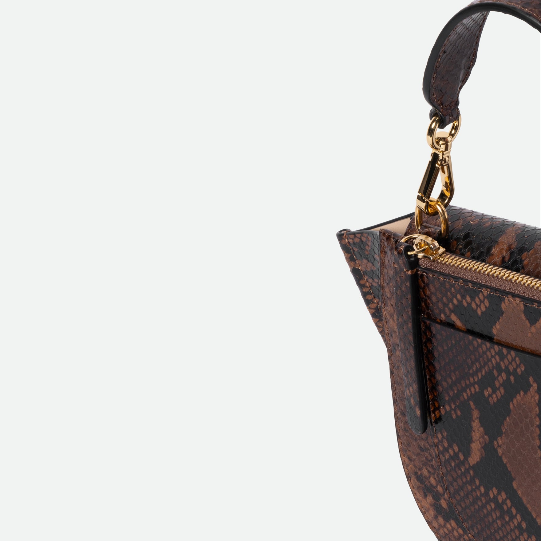 Wandler Hortensia Bag Mini in the color Brown Python, Italian calf leather with golden hardware, rounded silhouette and top handle, detail shot featuring a close up of the zipper and top handle. 
