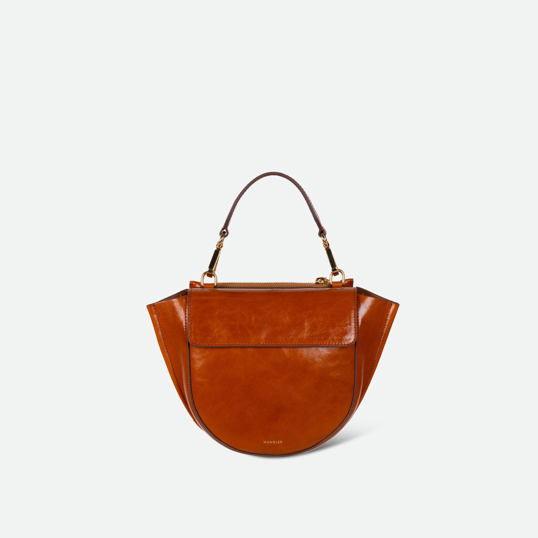 Wandler Hortensia Bag Mini in the color Cognac Eyelets, caramel brown, Italian calf leather with golden hardware, rounded silhouette and top handle, front view.