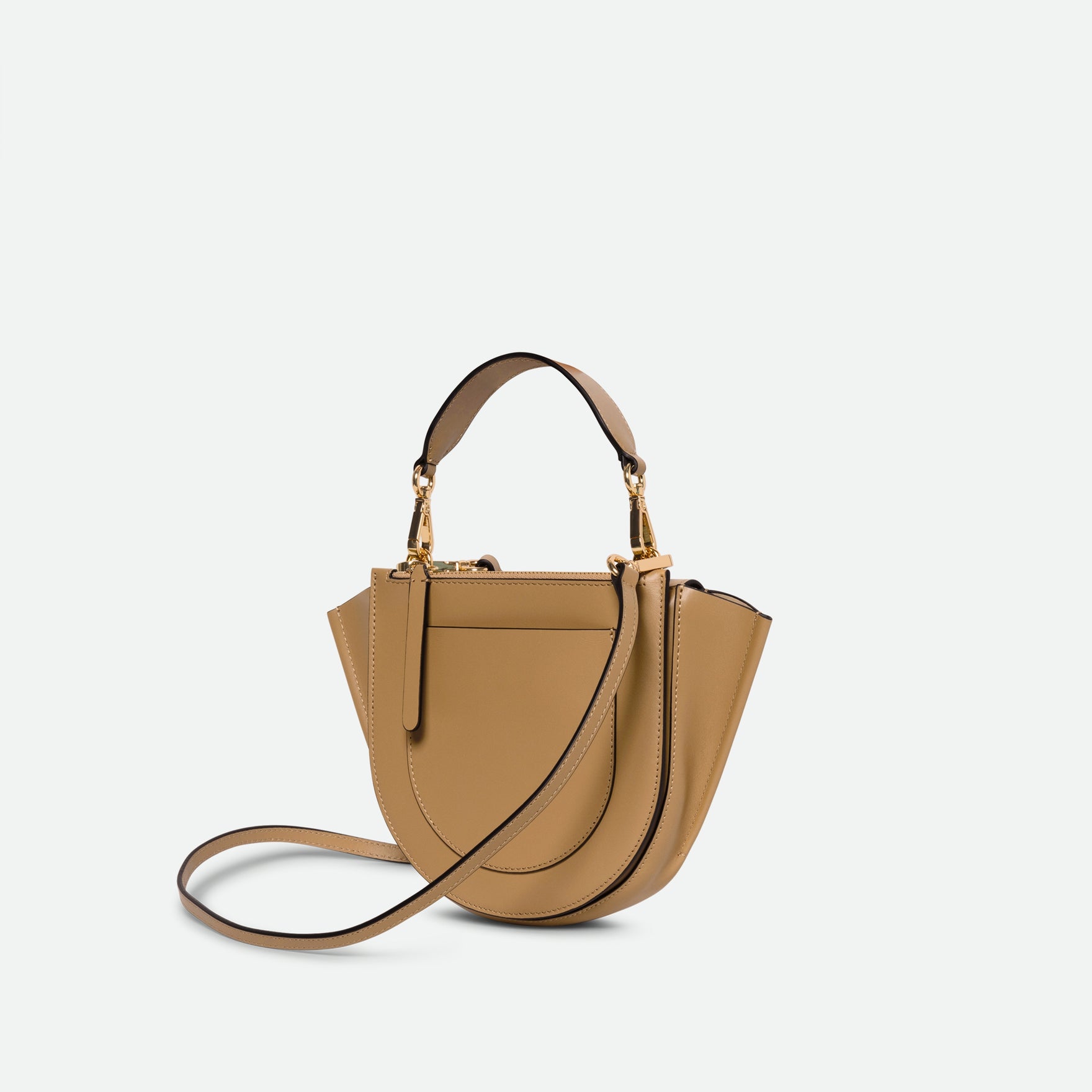 Wandler Hortensia Bag Mini in the color Gingerbread, dark beige, Italian calf leather with golden hardware, rounded silhouette and top handle, backside view.