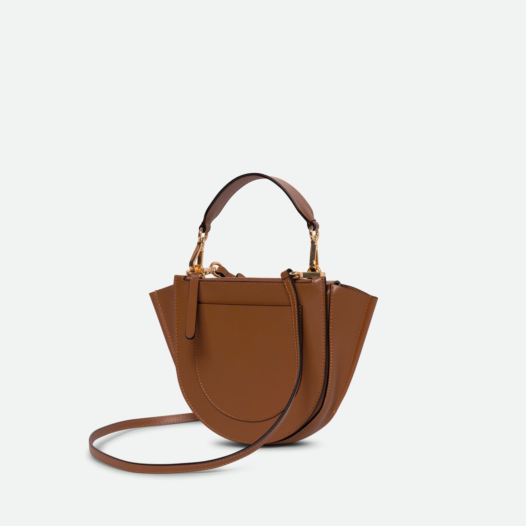 Wandler Hortensia Bag Mini in the color Saddle, brown, Italian calf leather with golden hardware, rounded silhouette and top handle, backside view.