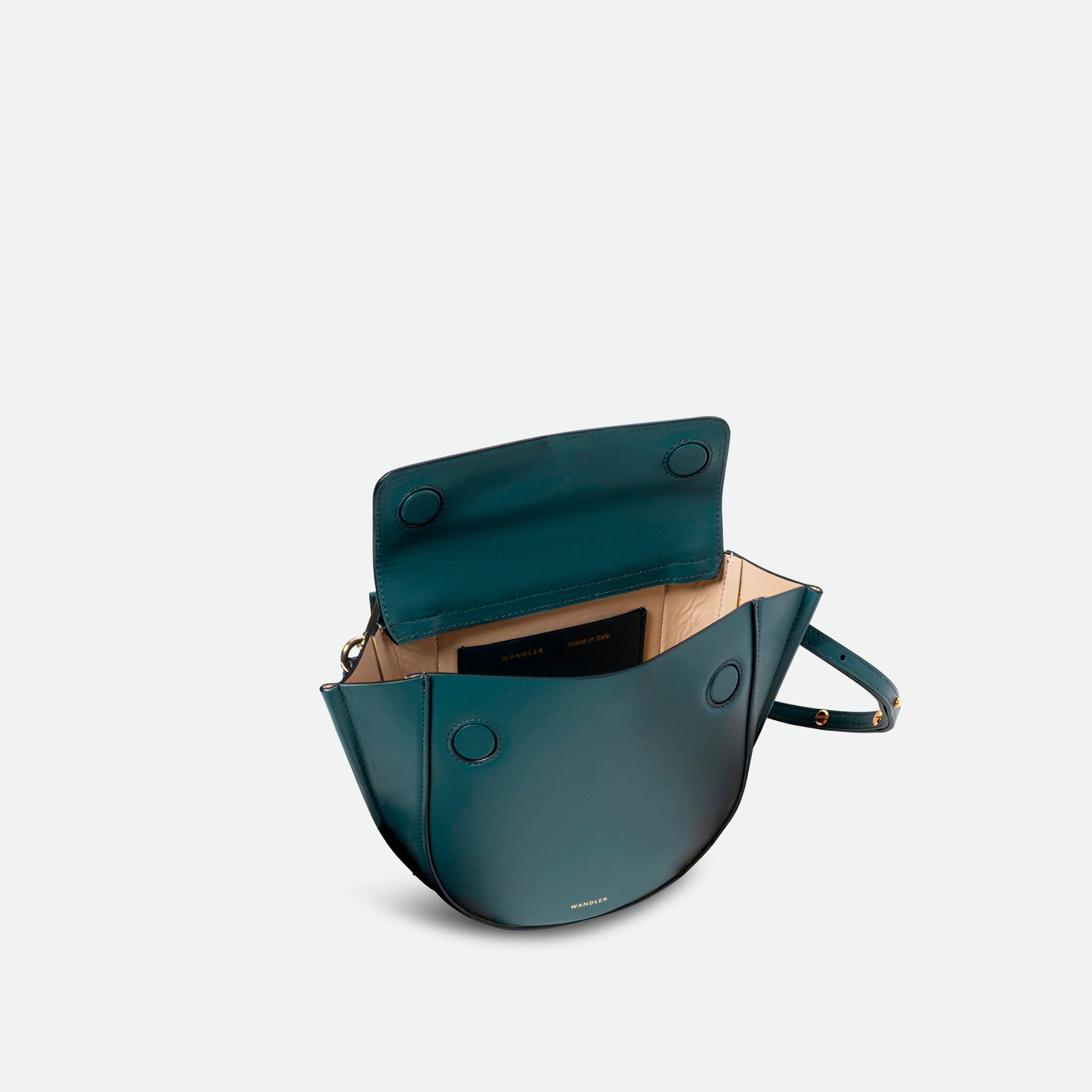 Wandler Hortensia Bag Mini in the color Teal, made from Italian calf leather with golden hardware, rounded silhouette and top handle, pictured from above with open flap, allowing for a glimpse of the inside of the bag.