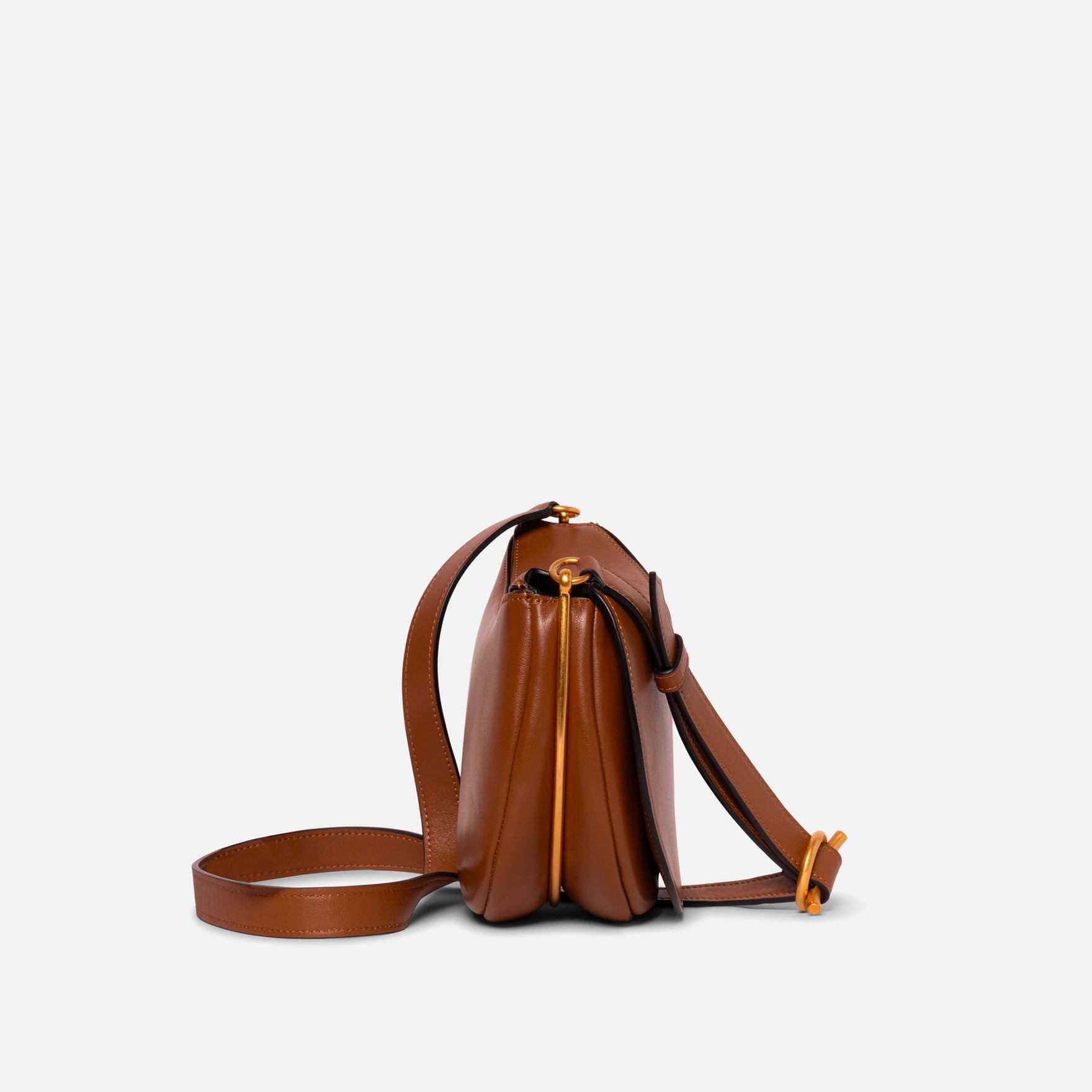 Wandler Kate Bag Big in the color Saddle, made from Italian calf leather with golden hardware and adjustable shoulder strap, side view.
