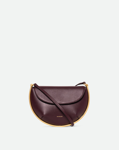 Wandler Kate Mini Crossbody in the color Grape, made from Italian calf leather with golden hardware and adjustable strap, front view.