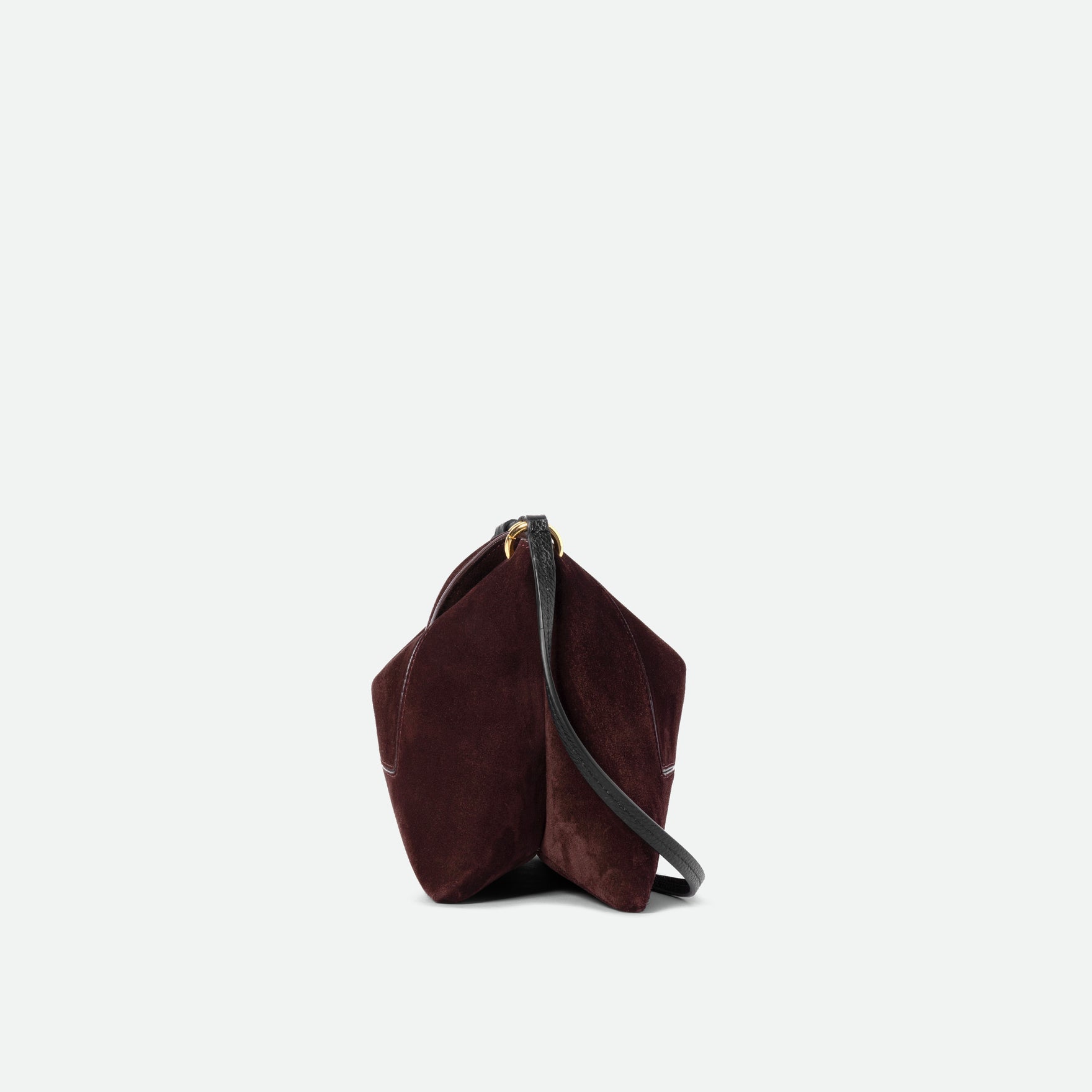 Wandler Penelope Slouch Bag in the color Acai Suede made from calf leather with golden hardware and adjustable slim strap, side view.